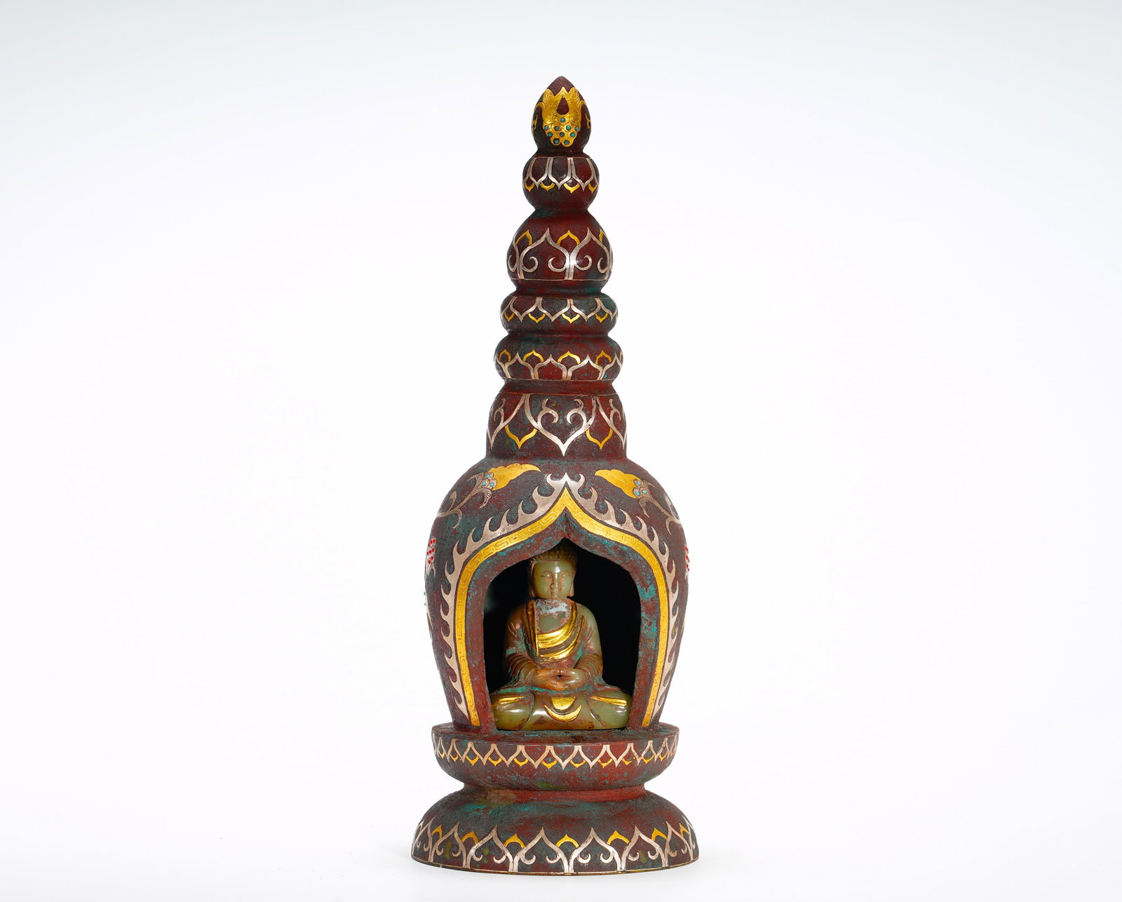 TANG DYNASTY BRONZE INLAID GOLD AND SILVER PAGODA NICHES: Height:30cm (11.81in) Width:12cm (4.72in) Weight:1920g(4.23lb)Mini bronze Buddhist stupa with layered spire, arched niche holding seated jade Shakyamuni. Surface decorated with lotus and flame pattern