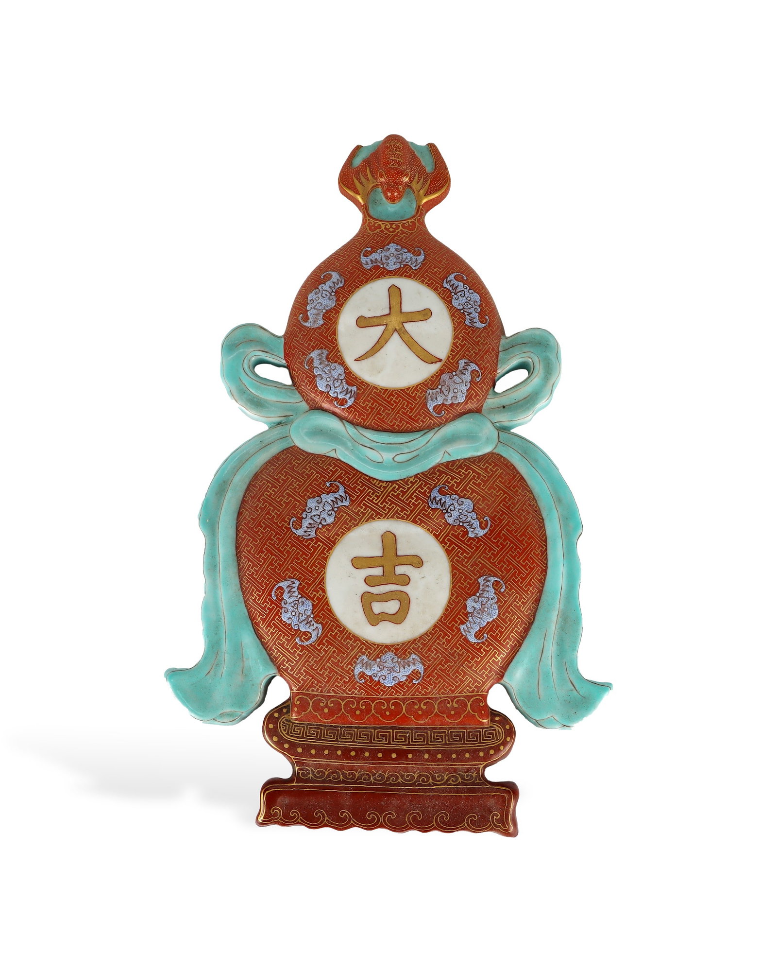 QING DYNASTY ALUM RED GILDED PORCELAIN HANGING SCREEN IN THE SHAPE OF A BIG GOURD: H:30.5cm W:19cm This is a famille rose iron-red gilded porcelain wall plaque shaped as double gourds for auspicious interior decoration. A bat sculpture representing fortune sits at the top. The whole