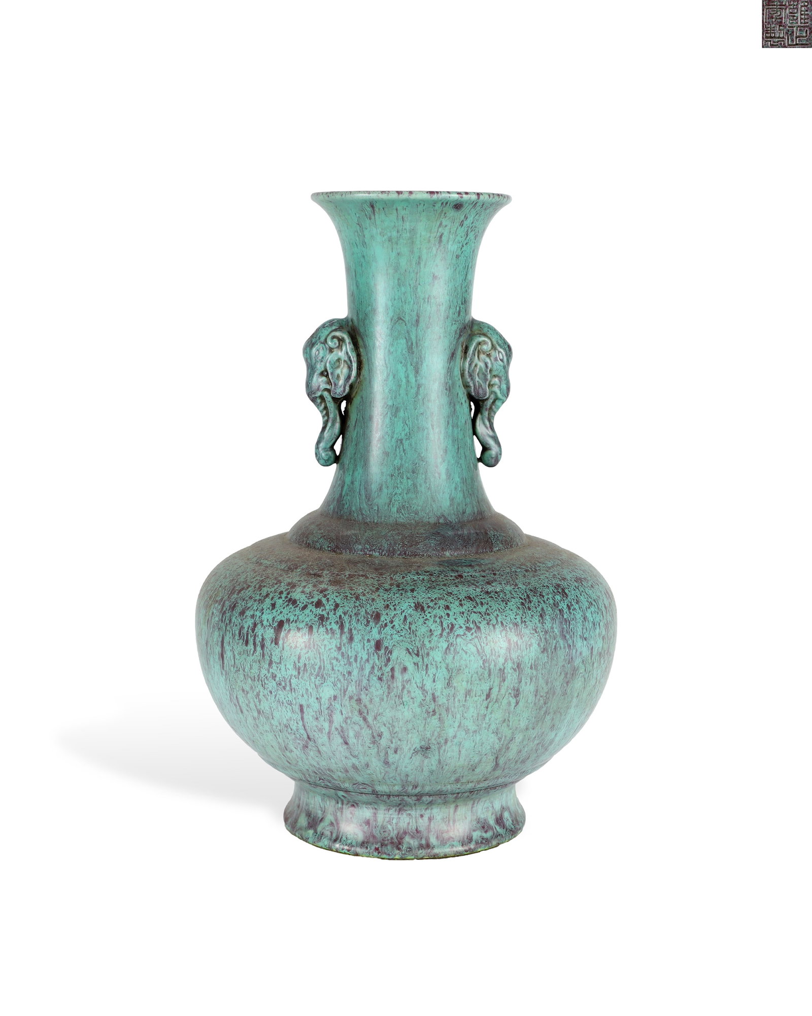 A QING DYNASTY YONGZHENG LUJUN GLAZE BOTTLE WITH ELEPHANT EARS AND A SLANTED MOUTH: H:24cm W:16.2cm Official Qing Yongzheng display vase covered in robin??s egg glaze. It has flared mouth, long neck, rounded belly and outward splaying foot, with a sculpted elephant head ear on the ne