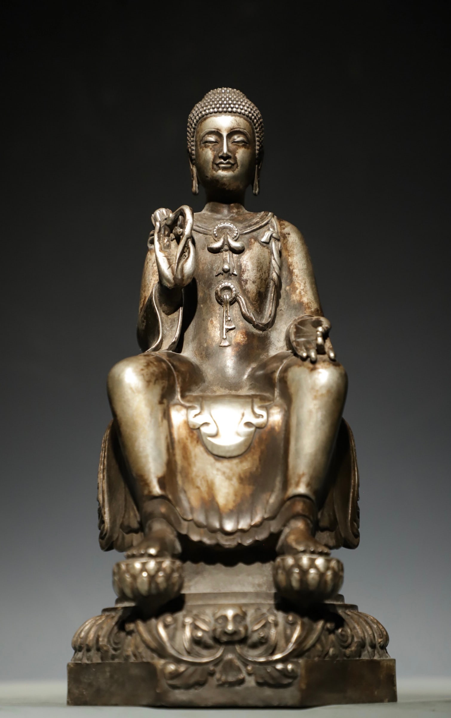 A SILVER-PLATED BRONZE STATUE OF SAKYAMUNI BUDDHA FROM THE MING DYNASTY (1 of 9)
