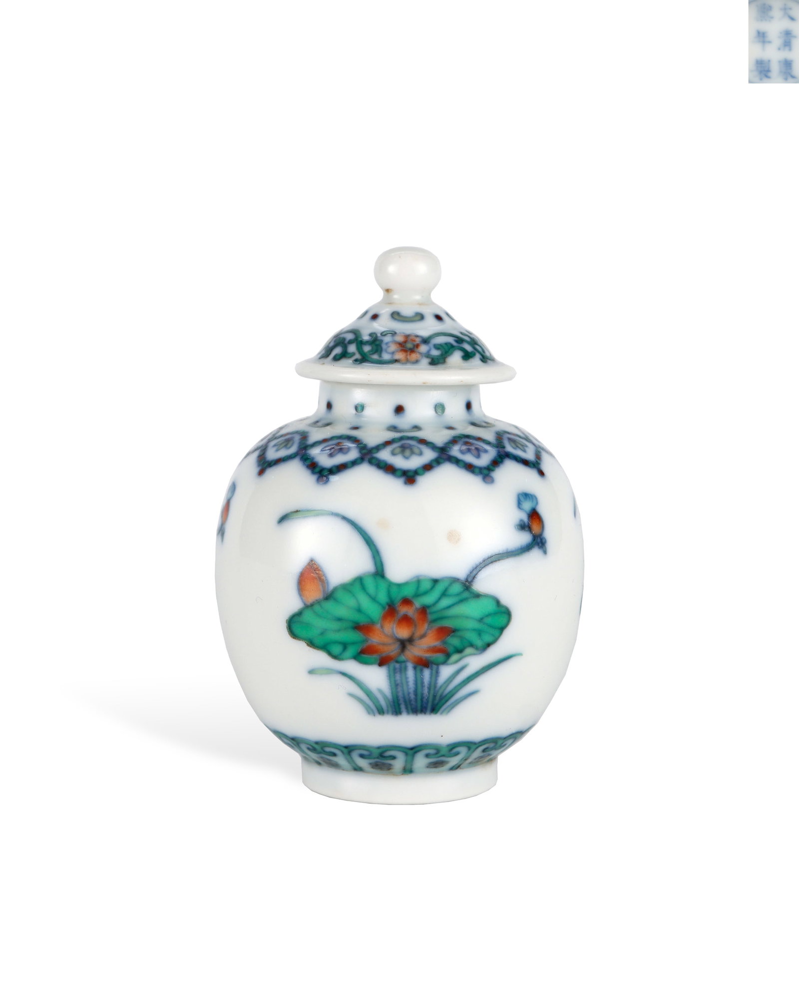 QING DYNASTY KANGXI DOUCAI LOTUS-PATTERNED SMALL LID JAR: H:8.3cm W:5.7cm Bright transparent doucai enamels, lotus symbolizes purity and harmony. Tiny delicate shape makes this an exquisite collectible porcelain of Kangxi era