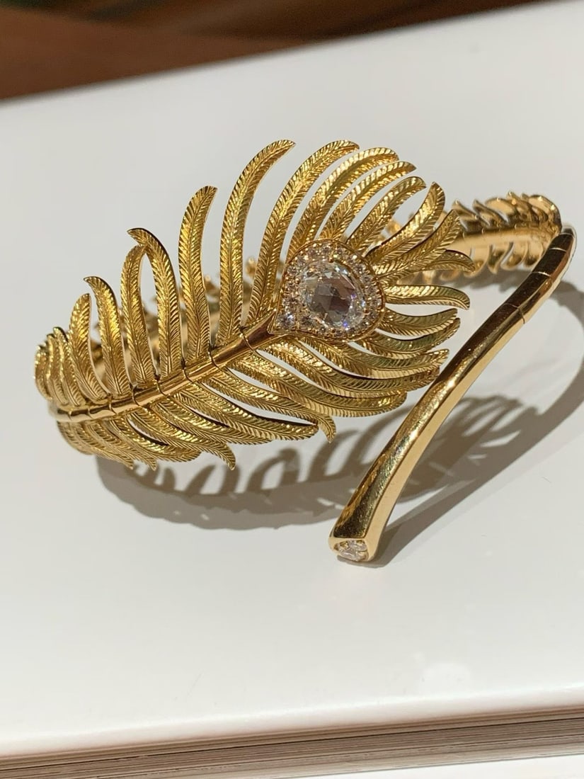 A PEACOCK FEATHER BRACELET FROM BOUCHERON'S NATURE TRIOMPHANTE COLLECTION: Weight: 38.1g, hand circumference: 15.5