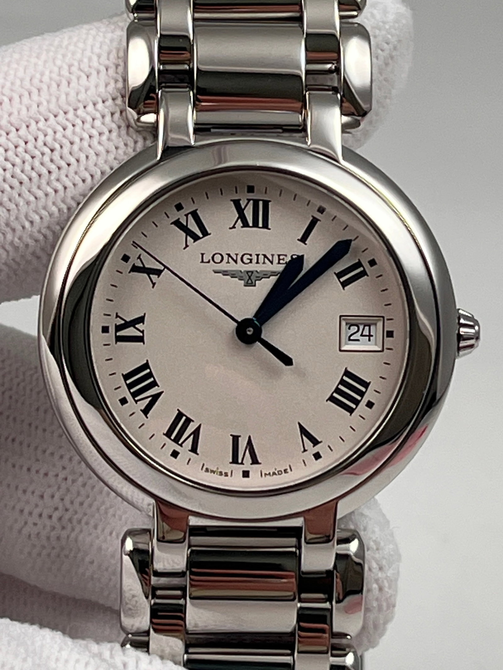 LONGINES LA GRANDE CLASSIQUE WATCHES: 34mm stainless steel case, white dial, quartz movement with date display, stainless steel link bracelet