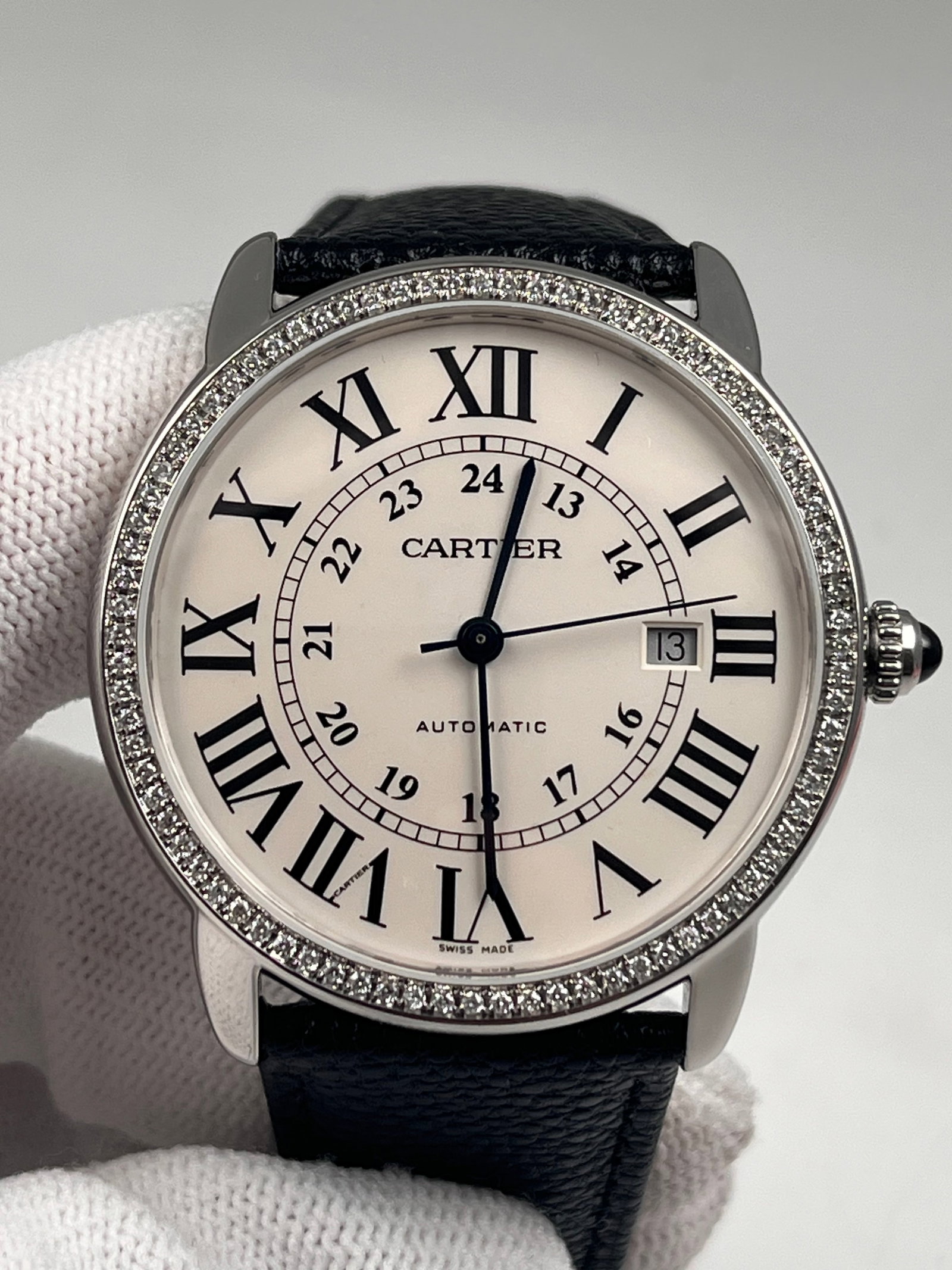 CARTIER WATCHES: 42mm stainless steel case with a brilliant round diamond set on the back, automatic mechanical movement, 42-hour power reserve, white dial with Roman numerals