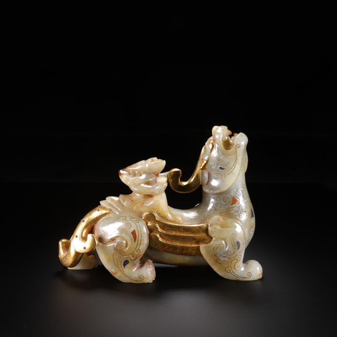 HAN DYNASTY HETIAN JADE INLAID WITH GOLD AND JEWELS, FEATHERED MAN RIDING BEAST: Long:17cm(6.69in), Width:5.3cm(2.09in), Height:11.8cm(4.65in), Weight:959g (2.114lb)Ancient jade ornament of mother and cub mythical beast with gold inlay and gemstones. Roundly carved from mild white