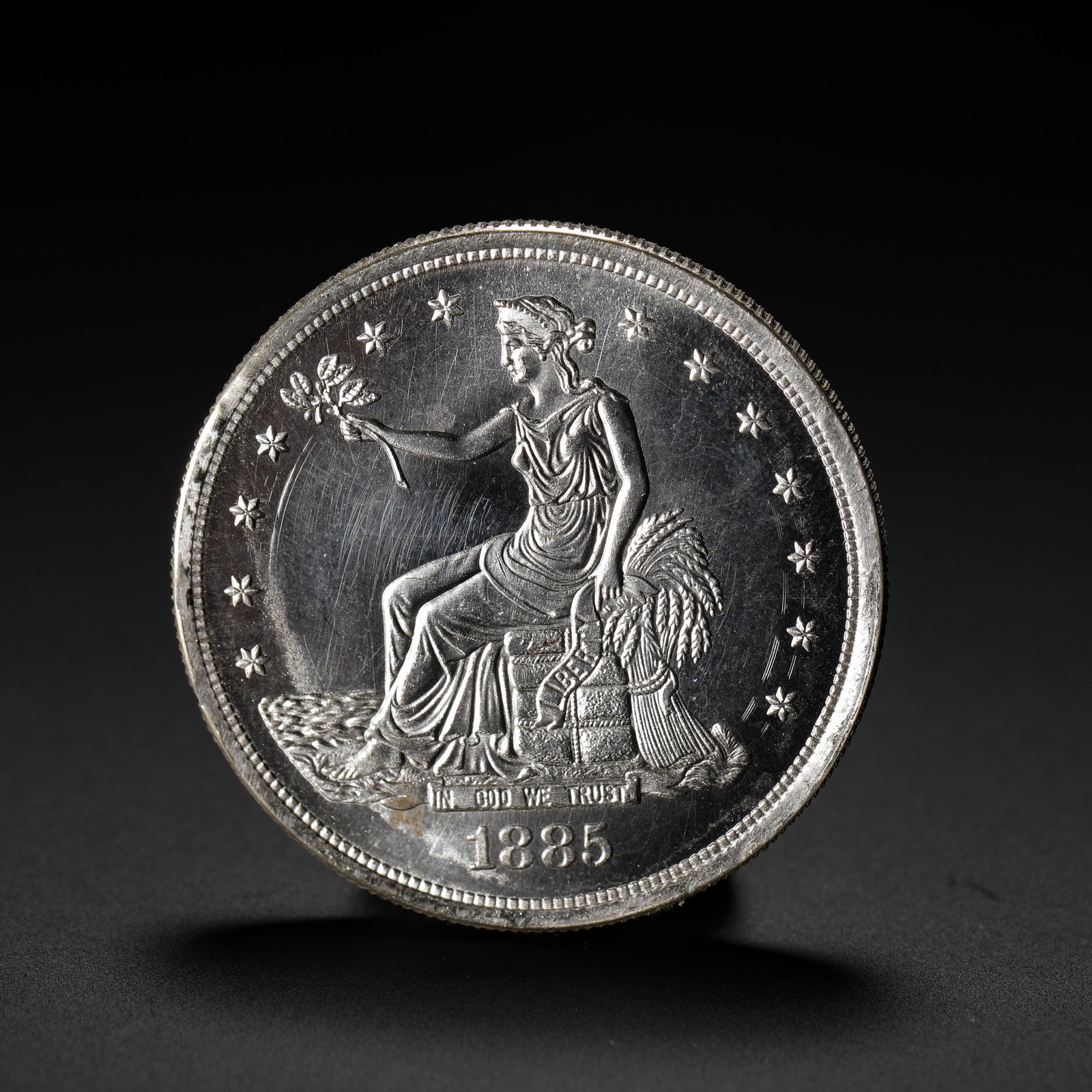 AMERICAN TRADE SILVER DOLLAR, 1885: D:3.9cm (1.54in) Weight:27g (0.06lb)A silver coin issued by the United States specifically for East Asian trade markets. The 1885 issue is the final year of the Trade Dollar series, with extremely low