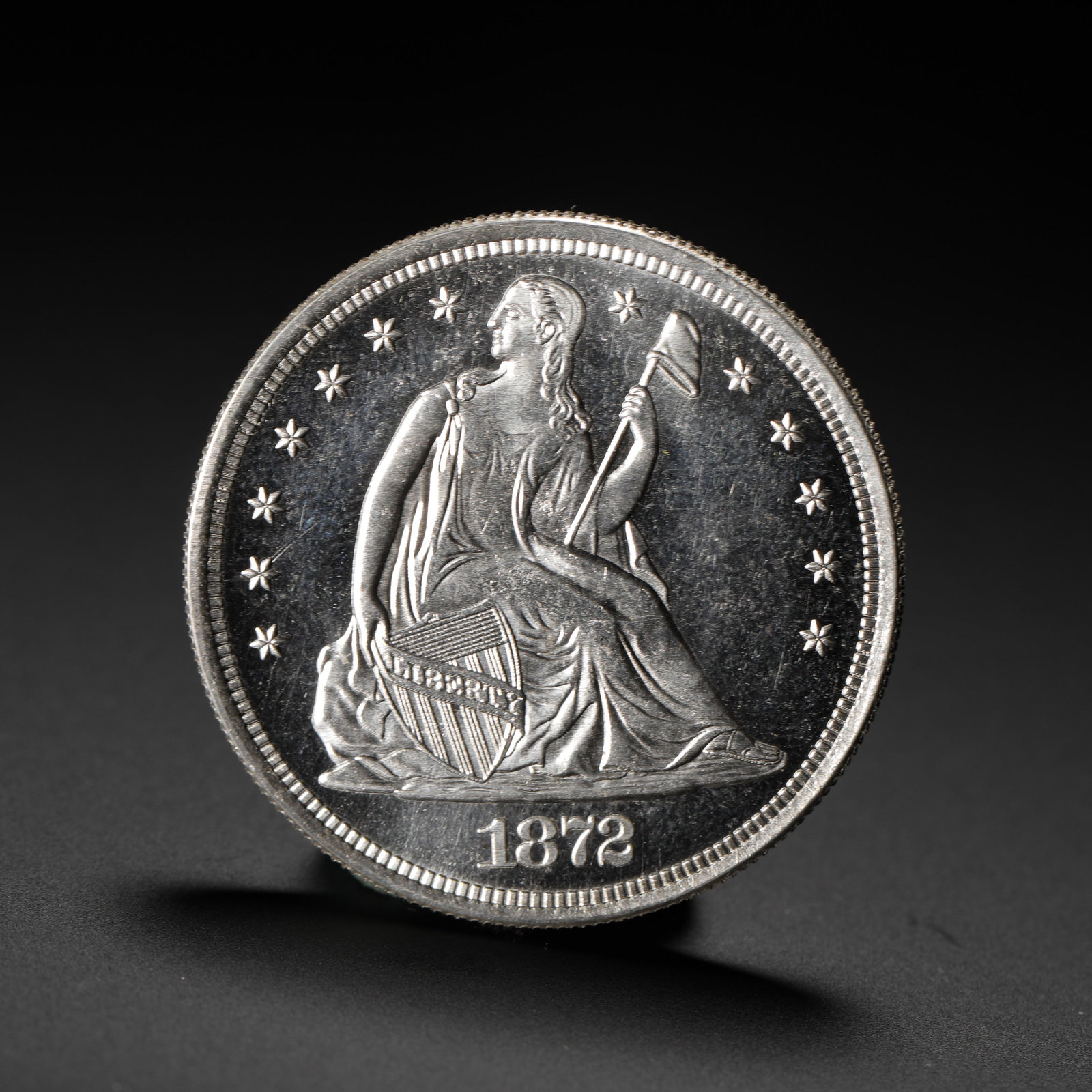 AMERICAN SEATED STATUE OF LIBERTY SILVER DOLLAR 1872: D:3.9cm (1.54in) Weight:27g (0.06lb)A key late-period issue of the Seated Liberty Silver Dollar series, minted in the penultimate year before the series' discontinuation, carrying both historical