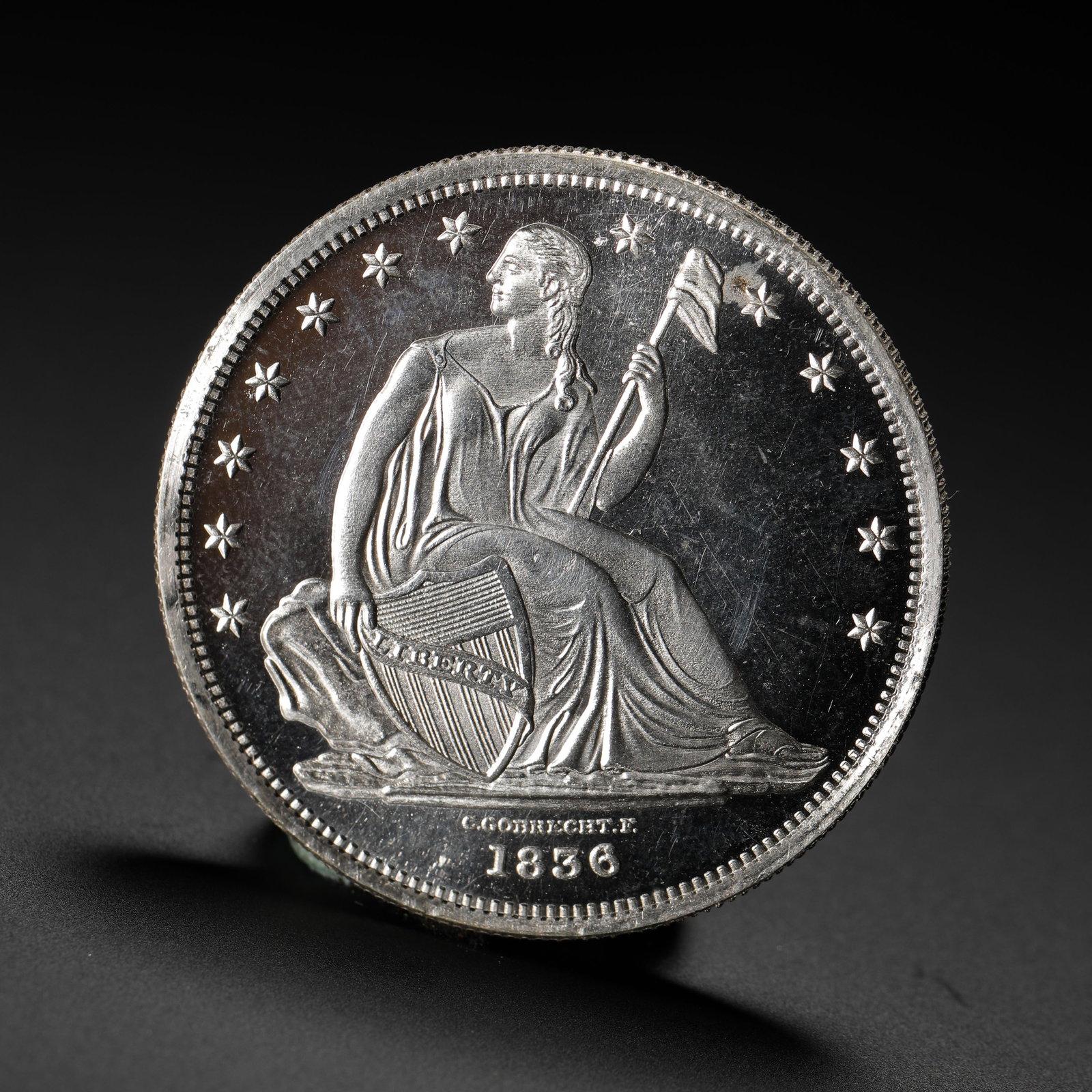 1836 US GOBRECHT SILVER DOLLAR: D:3.9cm (1.54in) Weight:27g (0.06lb)This silver coin is a prototype pattern for the Seated Liberty Silver Dollar series of 19th-century America, designed by engraver Christian Gobrecht. It is a landma