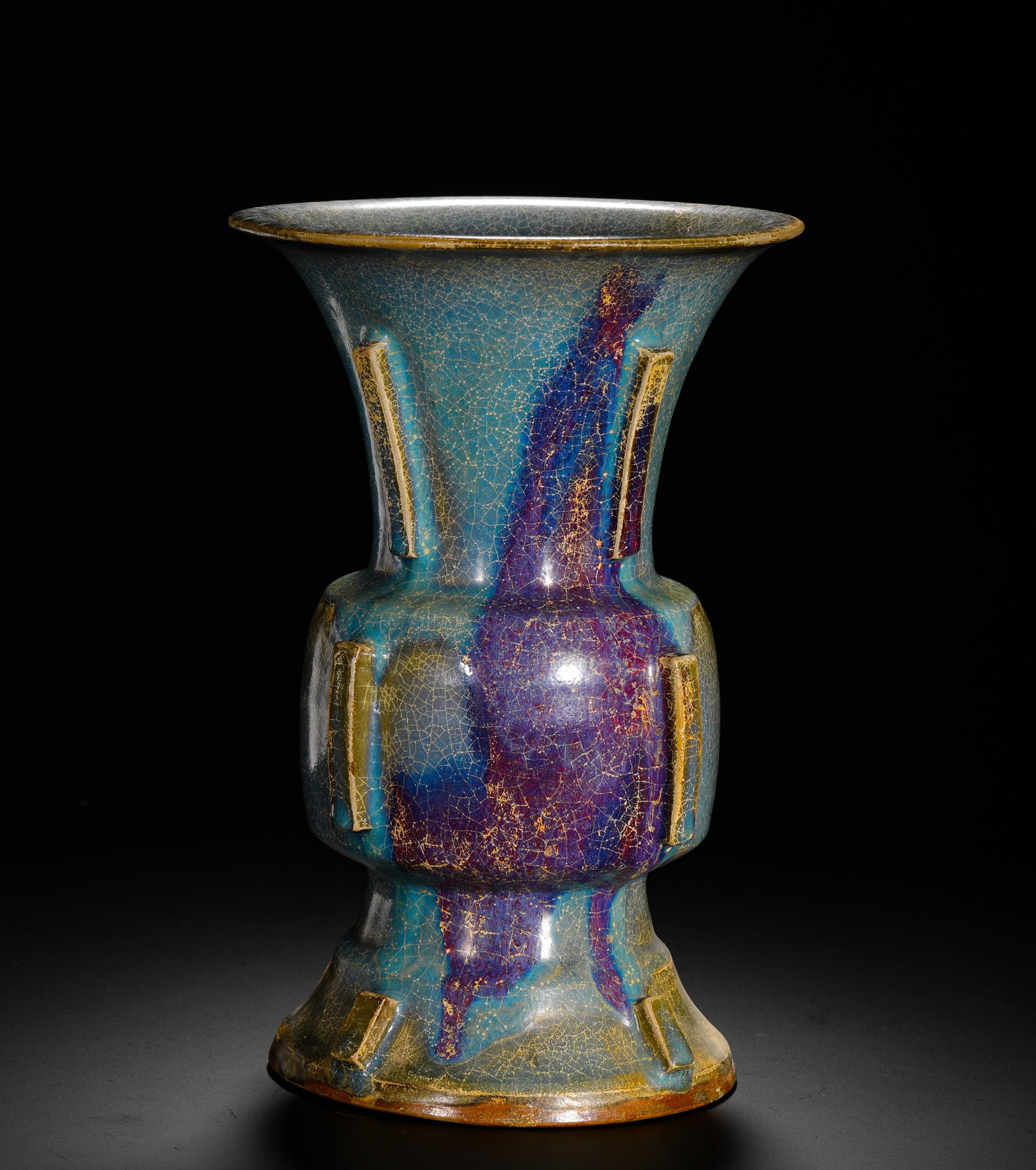 SONG DYNASTY JUN KILN SKY BLUE GLAZED PURPLE SPOTTED HALBERD-SHAPED VASE: H:28cm (11.02in) W:18.5cm (7.28in) Weight:2260g (4.98lb)This is a Song Dynasty porcelain zun vase from the Jun Kiln. Modelled after a bronze ritual vessel, it is covered in a celadon glaze with