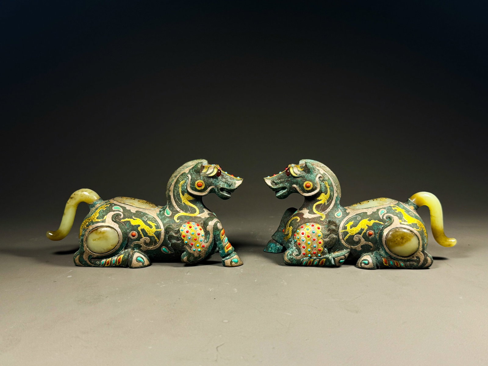 A HAN DYNASTY BRONZE INLAID GOLD AND SILVER INLAID TREASURE HORSE ORNAMENT (1 of 13)