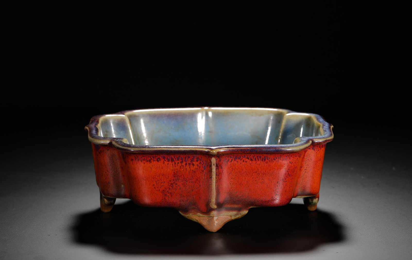 A ROSE PURPLE CRABAPPLE-STYLE NARCISSUS BASIN FROM JUN KILN OF THE SONG DYNASTY: H:7cm (2.76in) W:19.5cm (7.68in) Weight:810g (1.78lb)This is a Song/Yuan Dynasty Junyao porcelain basin with a begonia-shaped form and rose-purple glaze, a classic example of wares used for display an