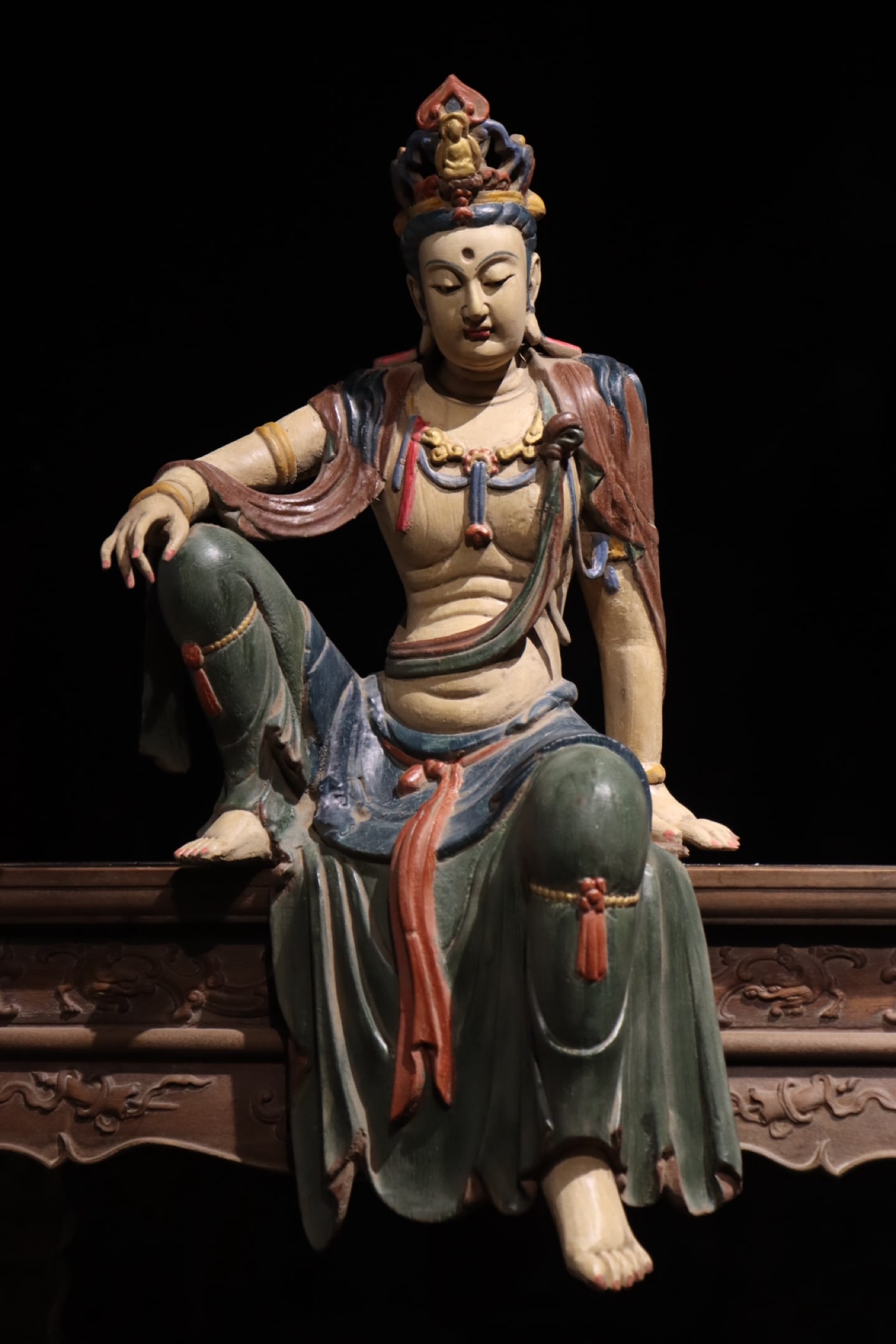 WOOD CARVINGS OF WATER MOON GUANYIN FROM THE MING DYNASTY: Height:61cm (24.02in)Wooden polychrome Guanyin in relaxed sitting pose, small Buddha carved on crown, multi-layer pearl necklaces, draped robes painted in traditional mineral colors, Chinese Buddhist 