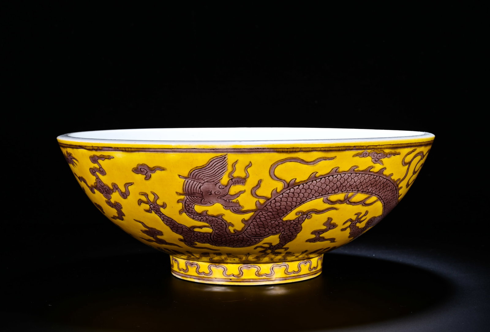 A LARGE BOWL WITH YELLOW GROUND AND BROWN COLORED CLOUD AND DRAGON PATTERNS (1 of 7)