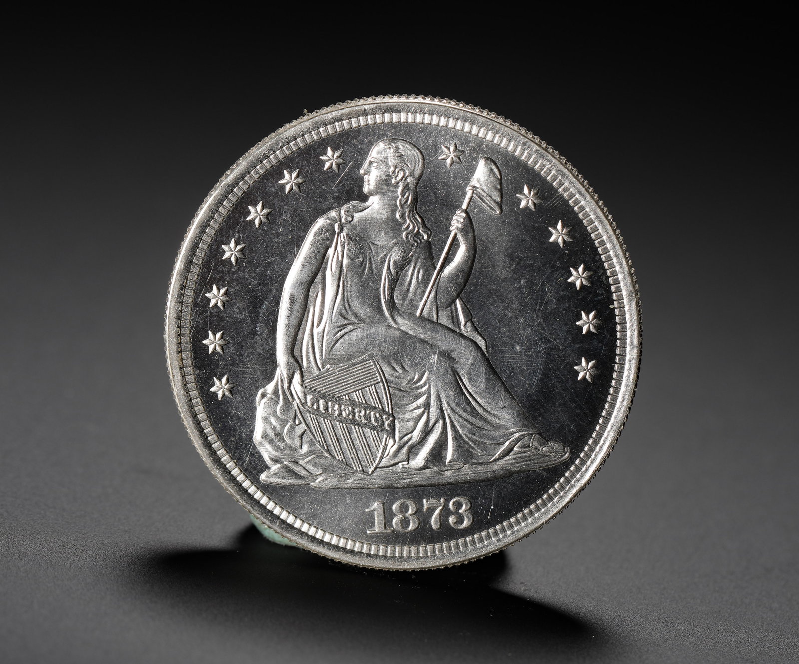 AMERICAN SEATED STATUE OF LIBERTY SILVER DOLLAR 1873: D:3.9cm (1.54in) Weight:27g (0.06lb) The final-year issue of the Seated Liberty Silver Dollar series, minted just before the introduction of the Trade Dollar, marking the end of an era in American coi
