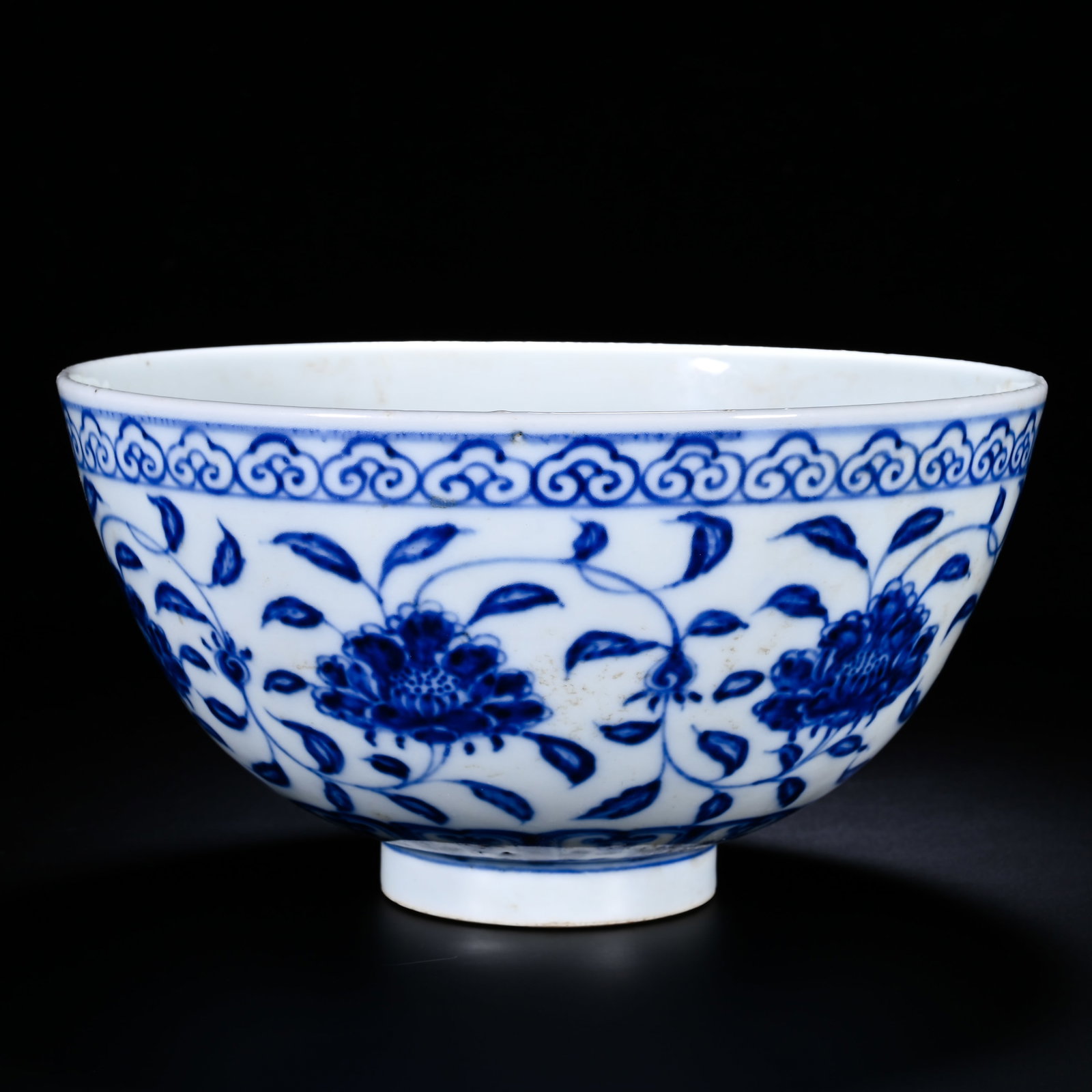 MING ZHENGDE BLUE AND WHITE ENTWINED PEONY PATTERN BOWL: Height:10cm (3.94in) , Diameter:18cm (7.09in) Bowl with flared rim, curved wall and ring foot, well?proportioned and stately. Inner rim decorated with ruyi?cloud border. Exterior fully painted with sc