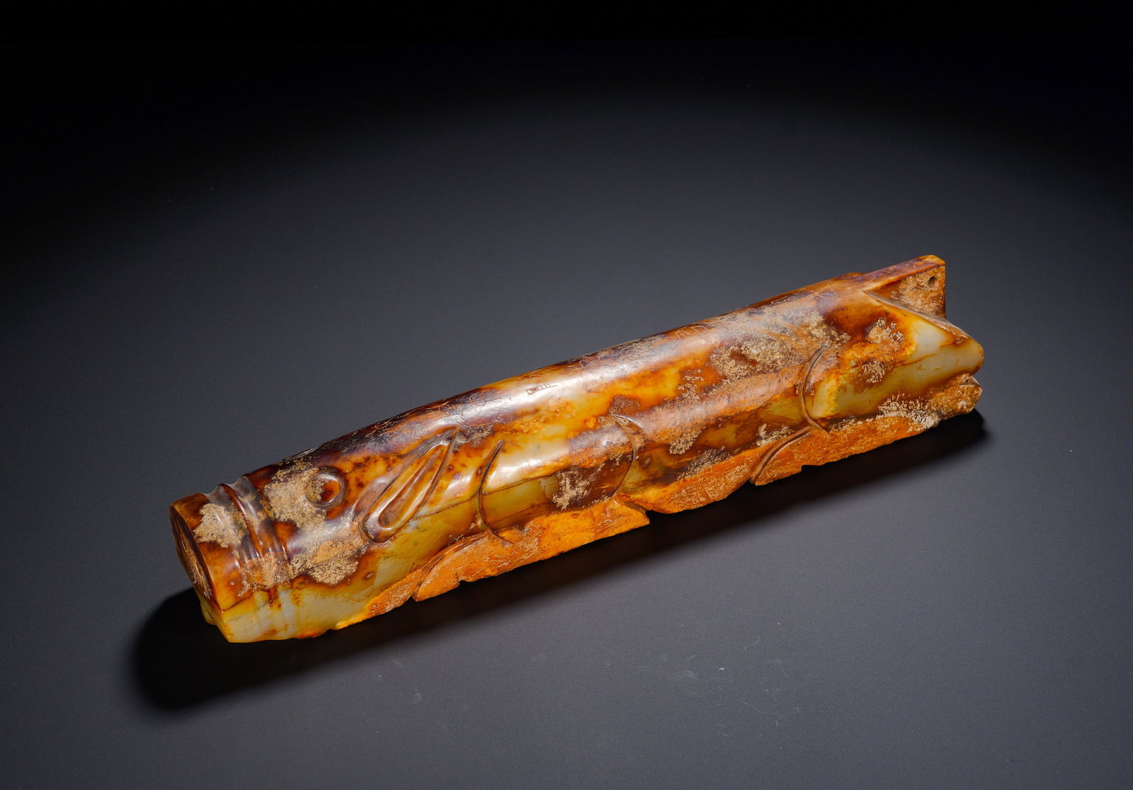 HAN JADE PIG GRIP: Height:5.5cm (2.17in) , Width:30cm (11.81in) , Weight:2040g (4.494lb) Carved from Hetian jade, this burial jade is modelled as a recumbent pig with sturdy elongated body, broad snout, prominent round