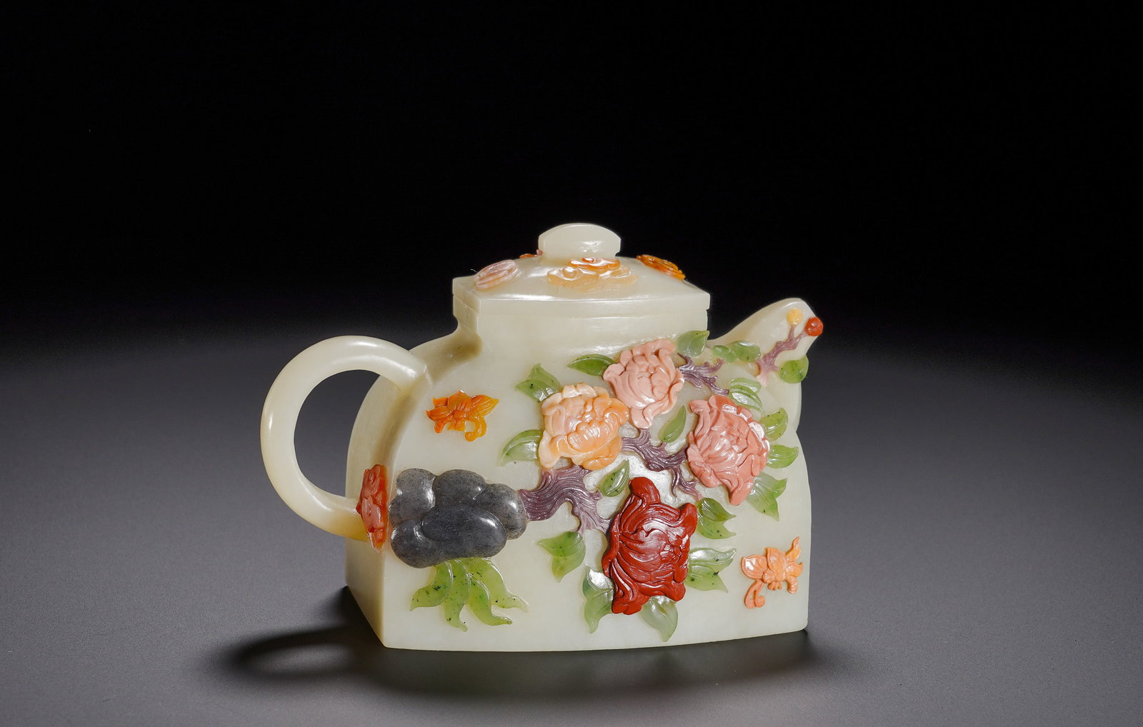 QING QIANLONG HETIAN WHITE JADE HUNDRED TREASURES INLAID WITH PEONY PATTERN SQUARE POT: Height:9cm (3.54in) , Width:2cm (0.79in) , Weight:310g (0.683lb) Carved from fine Hetian greenish?white jade with mild lustre. Fashioned as a flattened square teapot with smooth spout and handle, fitt