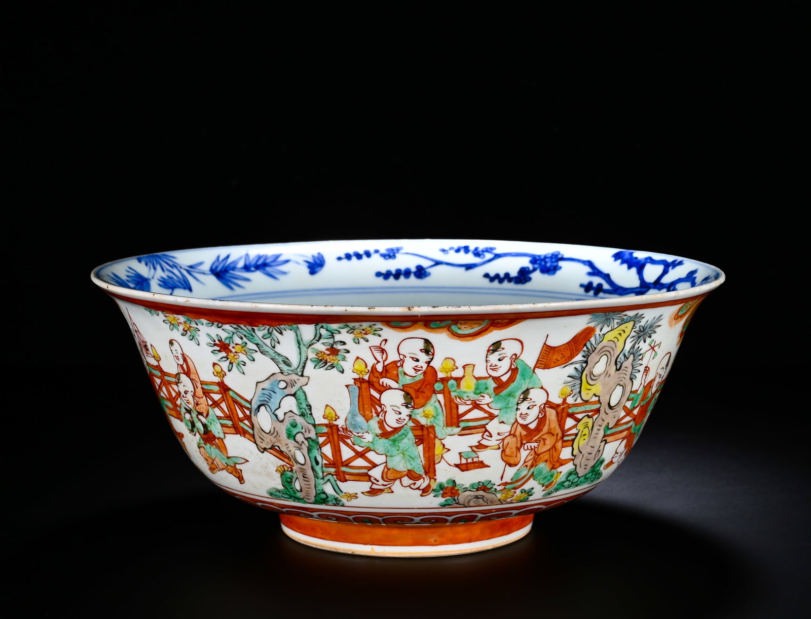 A LARGE BOWL OF THE MING JIAJING FIVE-COLOR BABY PLAY PICTURE: Height:23cm (9.06in) , Diameter:30cm (11.81in) A large official?ware wucai bowl of Jiajing reign, with flared rim, curved wall and substantial foot, generous and imposing in dimension. The exterior fu