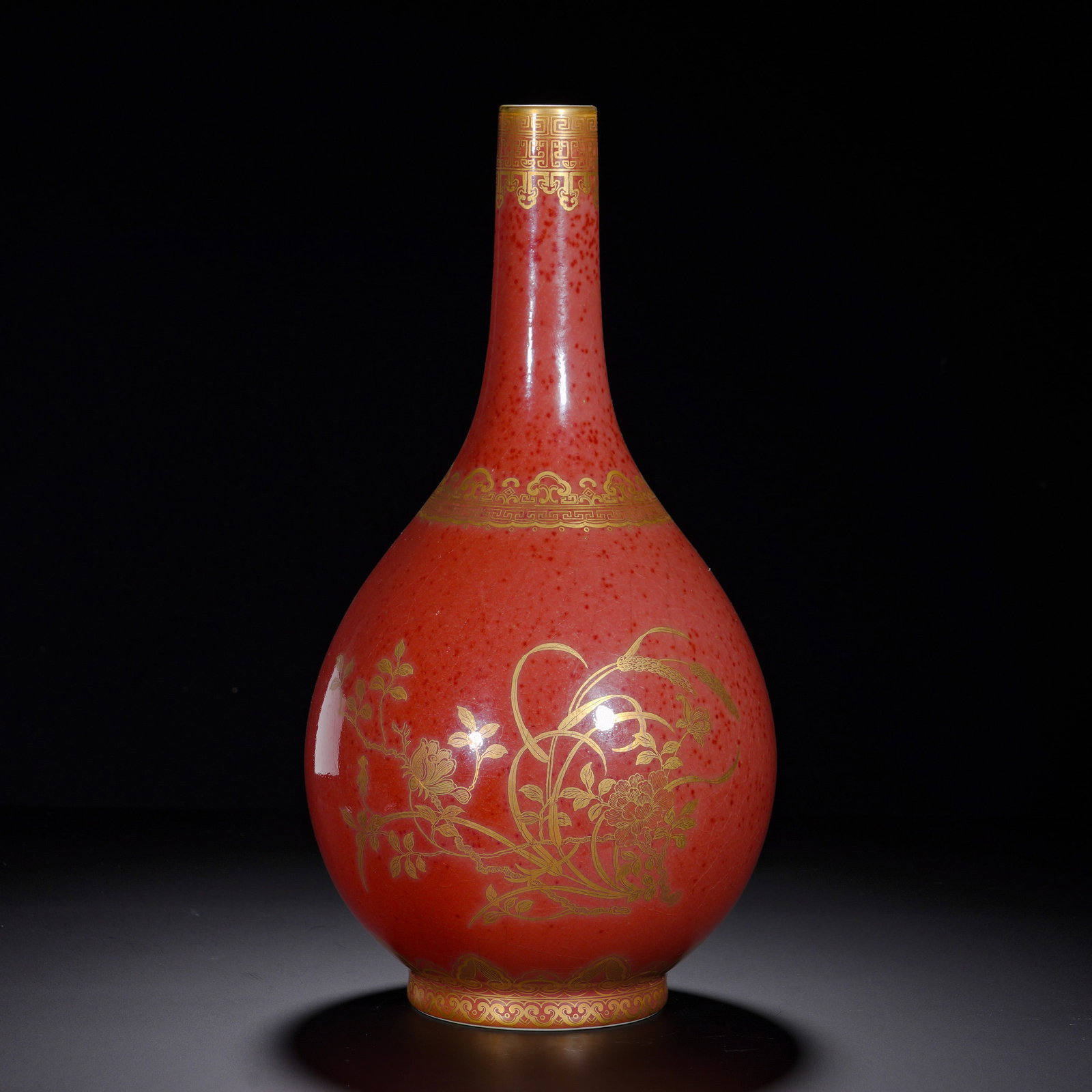 QING DYNASTY QIANLONG CORAL RED GROUND GILDED FLOWER-PATTERNED VASE: Height:33cm (12.99in) , Diameter:17cm (6.69in) , Weight:1510g (3.329lb) Imperial display porcelain of Qianlong reign, gall?shaped vase with slender neck and plump pear?shaped body, raised on short foo