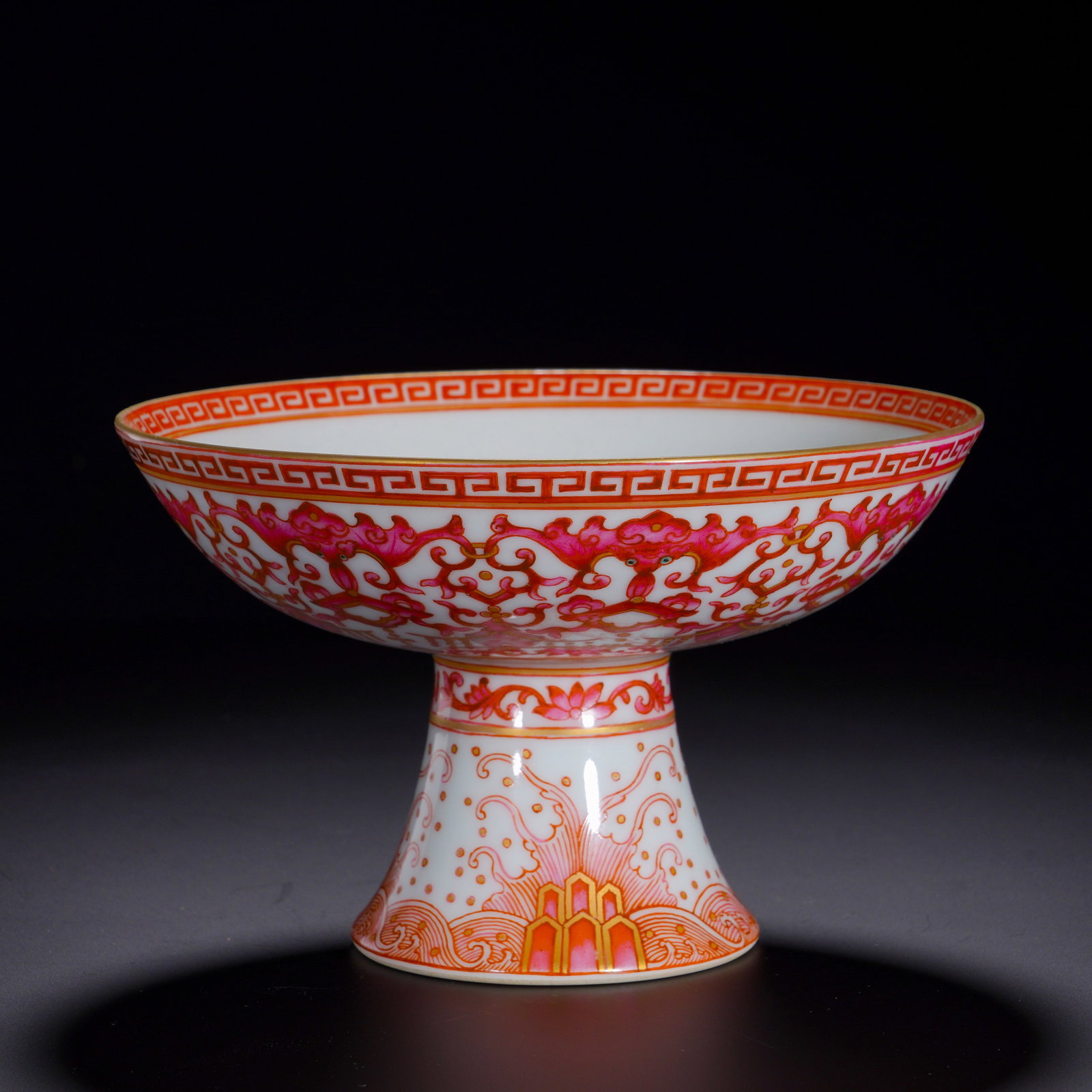 A HIGH-FOOTED OFFERING PLATE WITH GILDED AND ENTWINED LOTUS PATTERNS FROM THE QING DYNASTY'S: Height:10.5cm (4.13in) , Diameter:16.5cm (6.50in) An imperial Buddhist stemmed offering dish with wide flared rim, shallow bowl and tall flaring stem, rim edged with gilding. Painted on white ground i