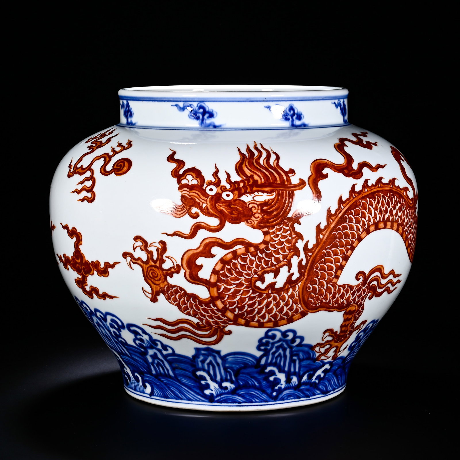 MING XUANDE BLUE AND WHITE ALUM RED SEA CLOUD DRAGON PATTERN LARGE JAR, "MADE IN THE XUANDE PERIOD: Height:28cm (11.02in) , Diameter:31cm (12.20in) This imposing jar features stout neck, full rounded shoulder and tapering lower body. The neck is decorated with underglaze?blue cloud patterns. The