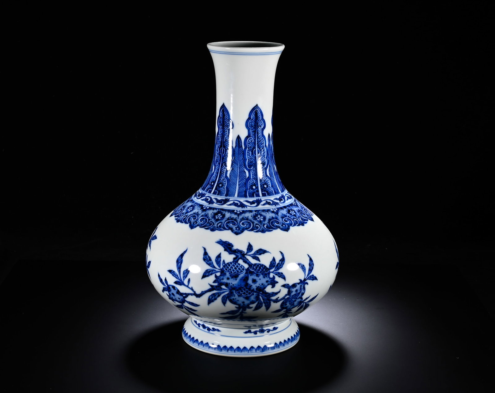QING DYNASTY QIANLONG BLUE AND WHITE THREE-PATTERNED WATER CHESTNUT VASE: Height:34cm (13.39in) , Diameter:20cm (7.87in) Noble stately water?chestnut?form display vase with flared mouth, long neck, compressed globular belly and splayed foot?ring. Neck decorated with