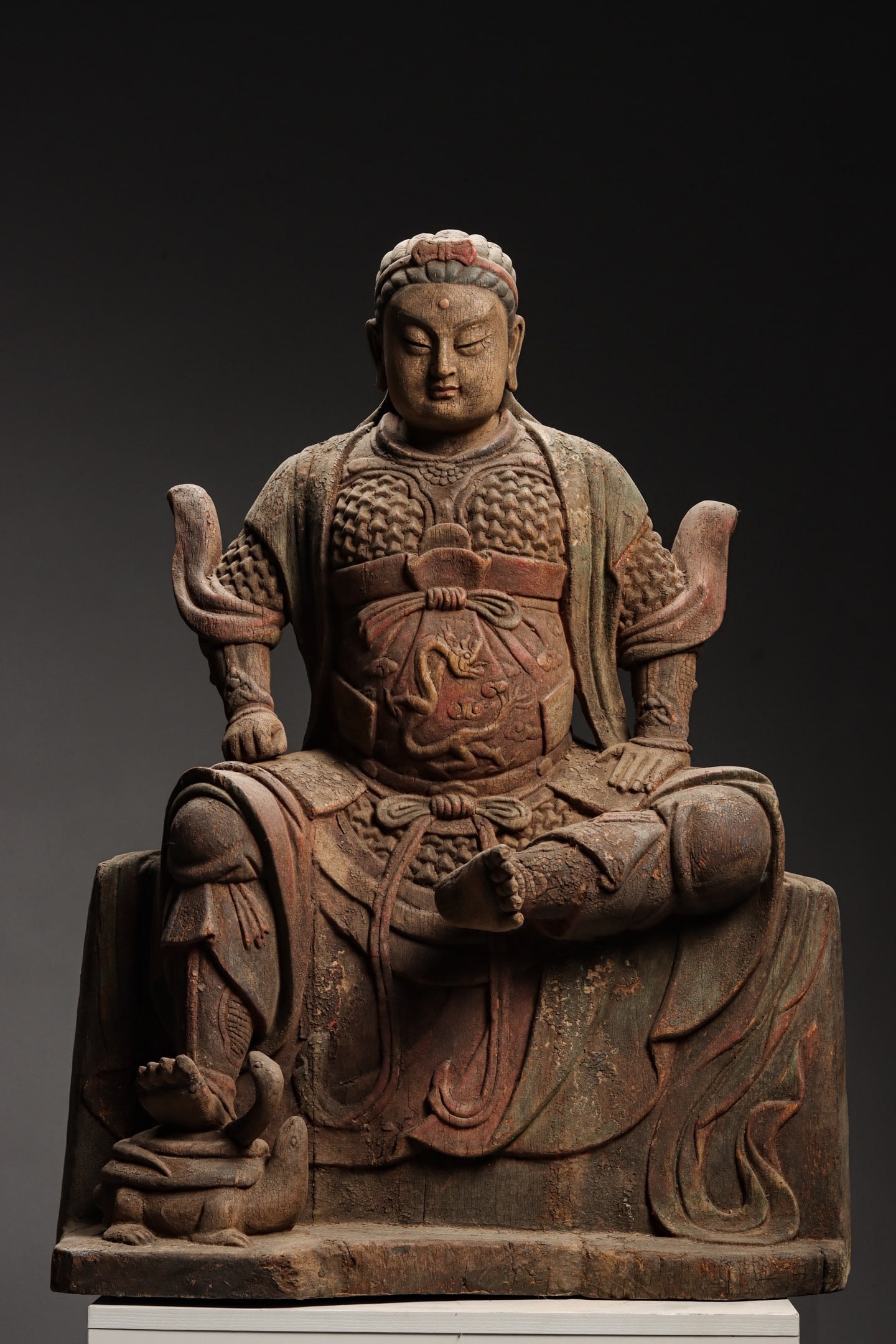 A WOODCARVING OF EMPEROR ZHENWU FROM THE SONG DYNASTY: Height:81cm (31.89in) , Width:60cm (23.62in) , Thick:36cm (14.17in) Zhenwu Emperor, the Northern God in Taoism, symbolizes protection and warding off evil spirits. A fine example of traditional Chines