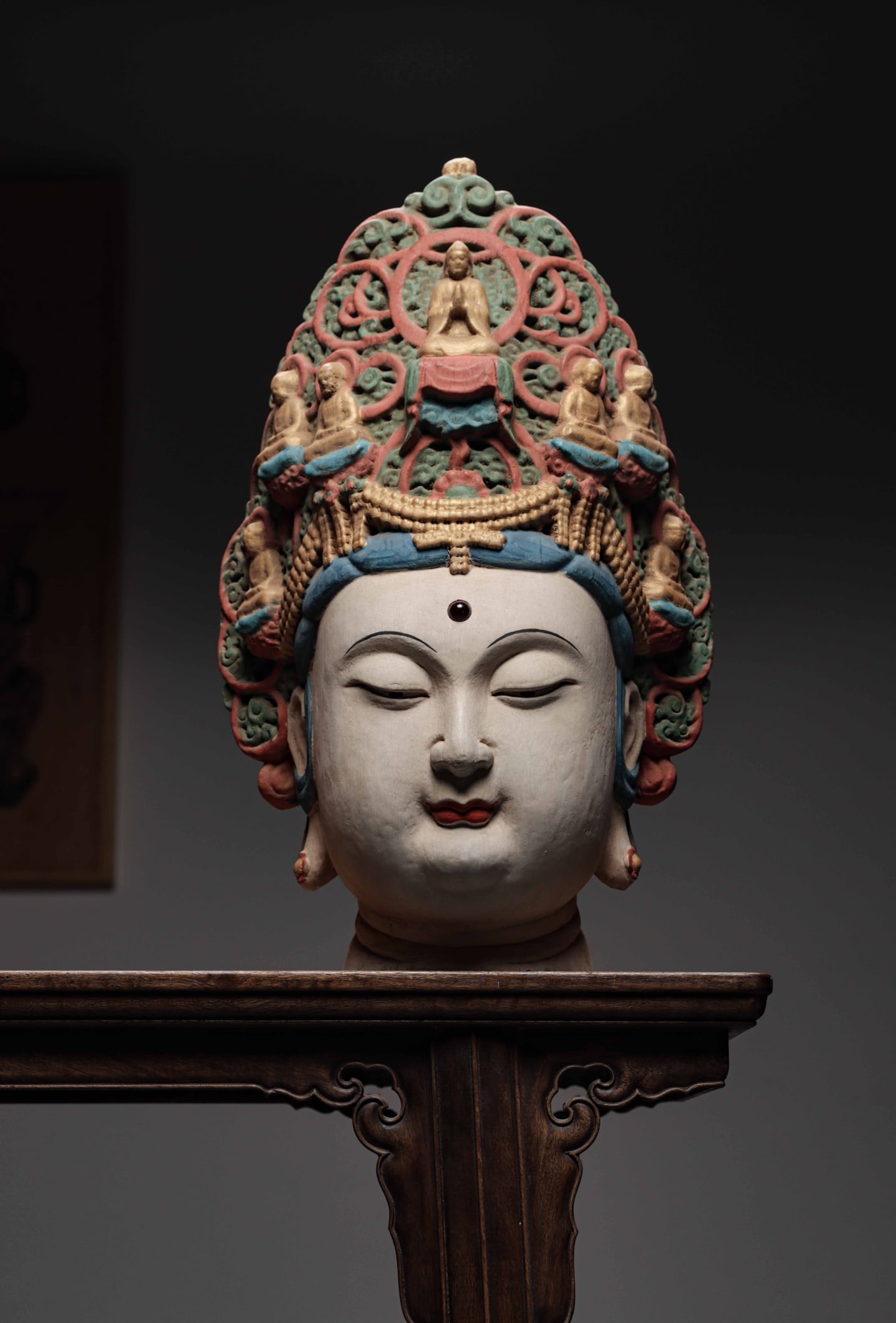 SONG DYNASTY WOODCARVING PAINTED GUANYIN BUDDHA'S HEAD: Height:52cm (20.47in) , Width:34cm (13.39in) , Thick:24cm (9.45in) Painted Wooden Head of Guanyin BodhisattvaCarved from wood, this Guanyin head features a plump, serene face with downcast eyes embody