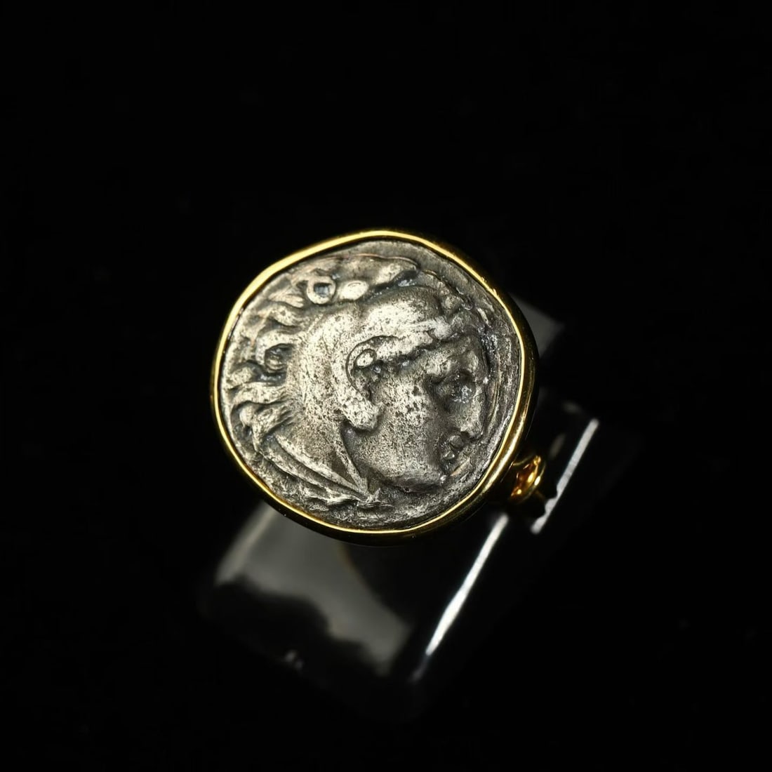 18K Gold Ring Set with Antique Coin Portrait of Heracles in Lion-Headdress: Ring Size: US 6.5 Wt:7.86g Having slain the Nemean Lion, Heracles flayed its pelt and wore it as armour, using the lion's head as his helmet, which aided him greatly in many subsequent brutal battles.