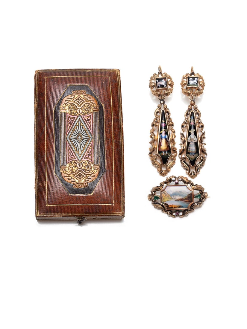 19th Century French 18K Gold Enamel Painted Suite for Export to Austro-Hungarian Empire: Brooch dimensions:2.2*4cmWt:6gEarring dimensions:1.8*7.5cmWt:14g 18K gold, rubies and emeralds. Exported from France to the Austro-Hungarian Empire at the time, it features a distinctive ethnic