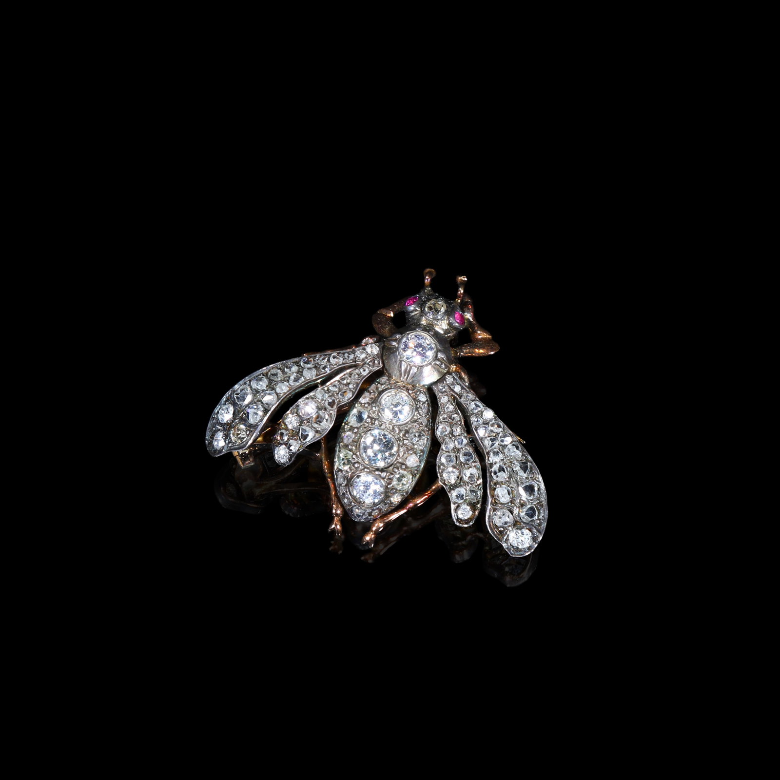 Late-Victorian (Circa 1880-1900) Silver-Topped-Gold, Diamond & Ruby Insect Brooch: 3.2*3.9cm Wt:11.4g Late-Victorian (Circa 1880-1900) insect brooch, silver-topped-gold. Open-work gold back-plate with silver upper setting surface for diamonds. Realistically modelled as a winged