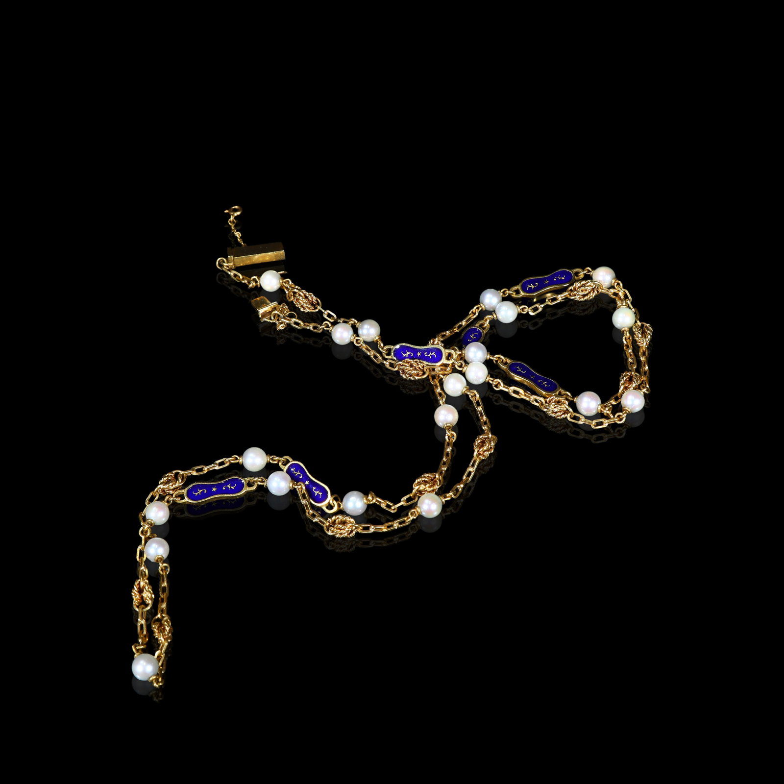 Edwardian-Period (Circa 1900-1910) Solid-Gold, Blue-Enamel and Pearl Fancy-Link Sautoir-Necklace: L:44cm Wt:42.8g Edwardian-Period (Circa 1900-1910) solid-gold sautoir-necklace, single-body constructed with fancy twin-bar link-work. Alternating along the necklace are deep-blue fired-enamel