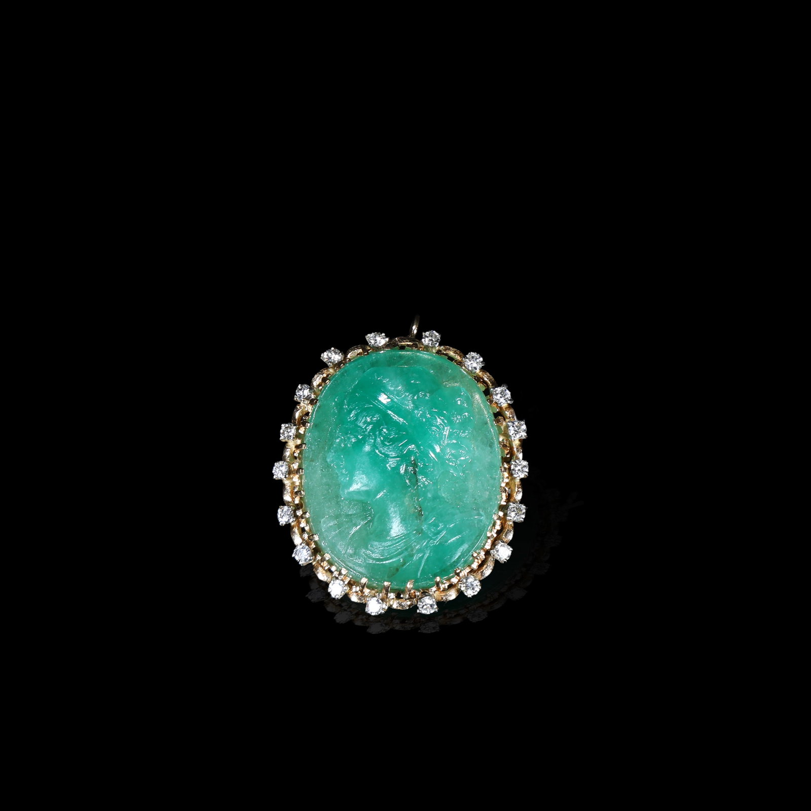 Late Victorian Carved Emerald Cameo, Gold-Mounted Old-Cut-Diamond Surround Brooch-Pendant, Circa: 3.05*2.73cm Wt:13.84g Late-Victorian cameo brooch-pendant, circa 1880-1900. Carved from solid emerald depicting female profile portrait with fine details for hair and drapery. Set in gold mount surrou