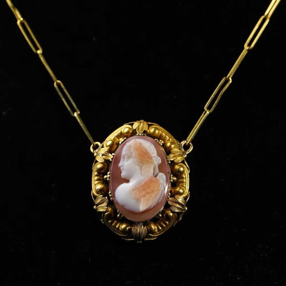 French Napoleon III Period (1852-1870) 18K Gold Necklace with Hardstone High-Relief Cameo: Chain Length:41.5cm Wt:8.2g Handcrafted entirely in 18K gold. Contrasting agate is cleverly carved into a high-relief cameo, paired with Baroque-style three-dimensional openwork gold carving. Artistic