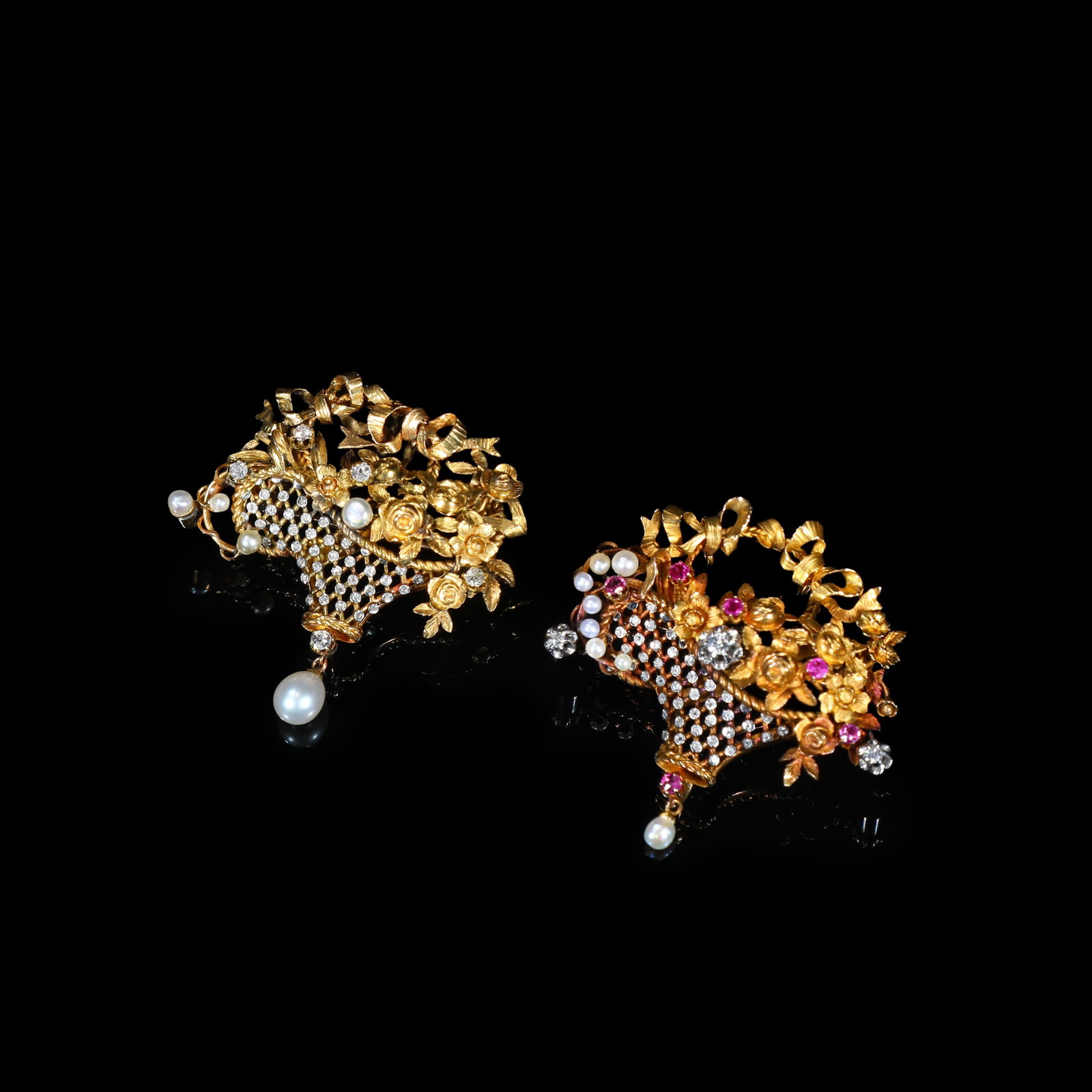 Pair of Late-Victorian Gold Basket-Form Brooches set with Pearls, Diamonds and Rubies: 4*4.15cm Wt:11.63g/4.06*4.07cm Wt:11g Pair of Late-Victorian gold brooches modelled as flower-filled baskets. Open-work filigree basket bodies pav??-set with diamonds, decorated with three-dimensional