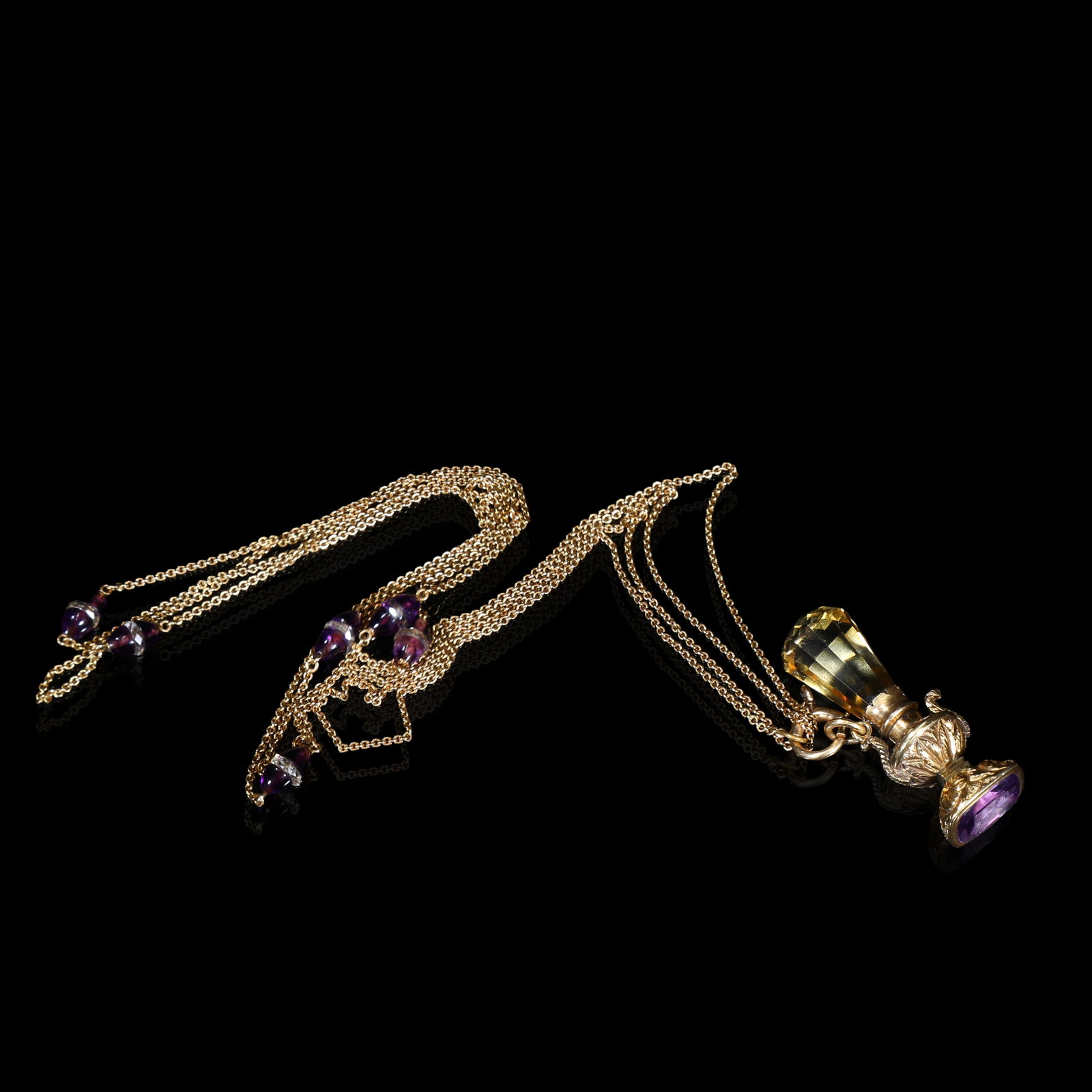 Victorian Gold Vase-Form Seal Fob Pendant, Citrine & Amethyst, With Original Gold Chain, Circa: 4.23*1.6cm Chain Length:61.5cm Wt:25.05g Victorian vase-form seal fob pendant, circa 1860-1880. Modelled in cast gold as a miniature scent-flask, set with citrine at upper portion and amethyst to base