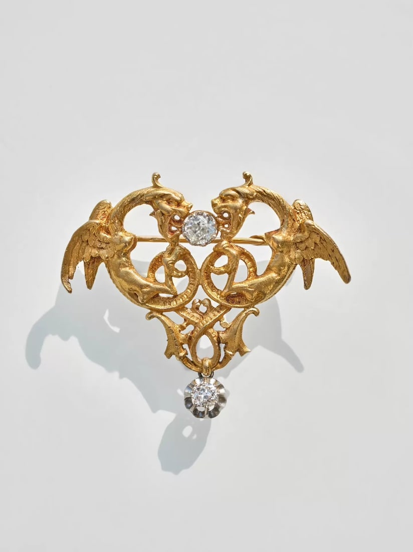 19th Century Antique 18K Gold Chimera Brooch set with Diamonds: 4.7*4.6cm Main diamond approx. 0.5 ct Total weight approx. 0.75 ct-Wt:20.3g The chimera is a mythical beast from ancient Greek mythology, a common motif in Western art and architecture, most famously 