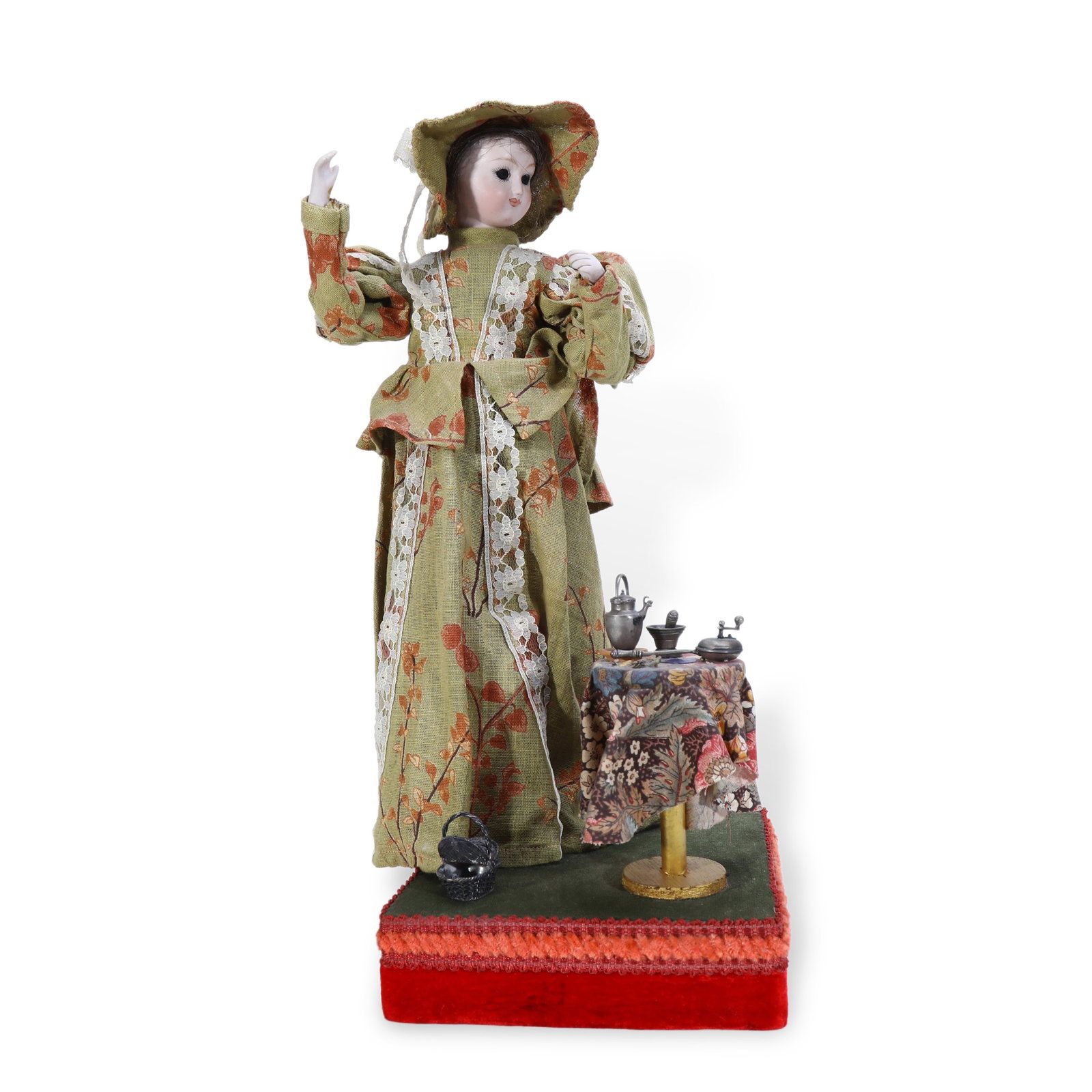 19th Century Musical Automaton of a Lady Taking Afternoon Tea: H:38cm W:19.5cm Once wound and activated, the timepiece plays music while the figure performs synchronized movements:its head slowly turns side to side, arms alternately lift as if sipping tea and rai