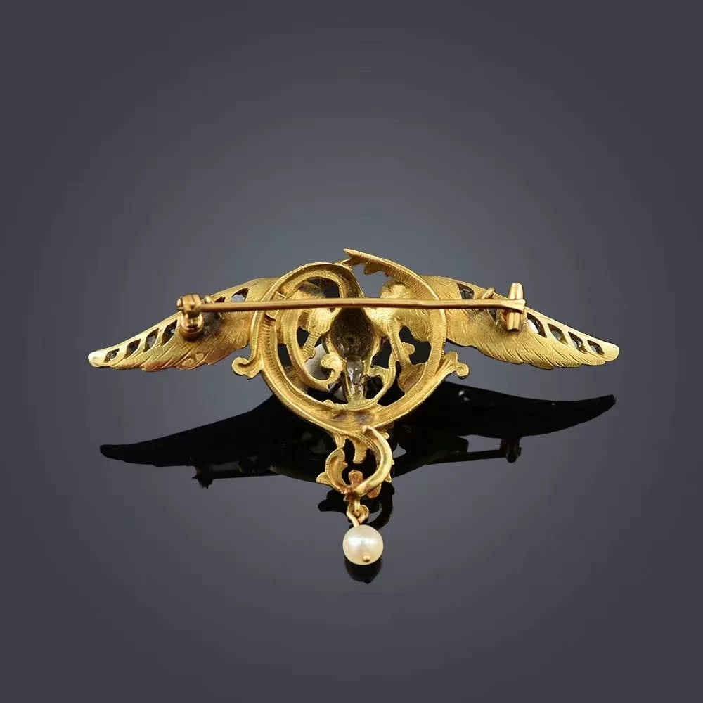 French 1900s Art Nouveau Antique 18K Gold Diamond-Set Pearl Chim??re Brooch / Necklace: 6.3*4.15cm 16 diamonds, total weight approx. 0.92 ctWt:27.0g A classic Chimera mythical-beast motif. The winged-dragon spreads its wings wide, perching upon scrolling vines and spitting forth a pearl 