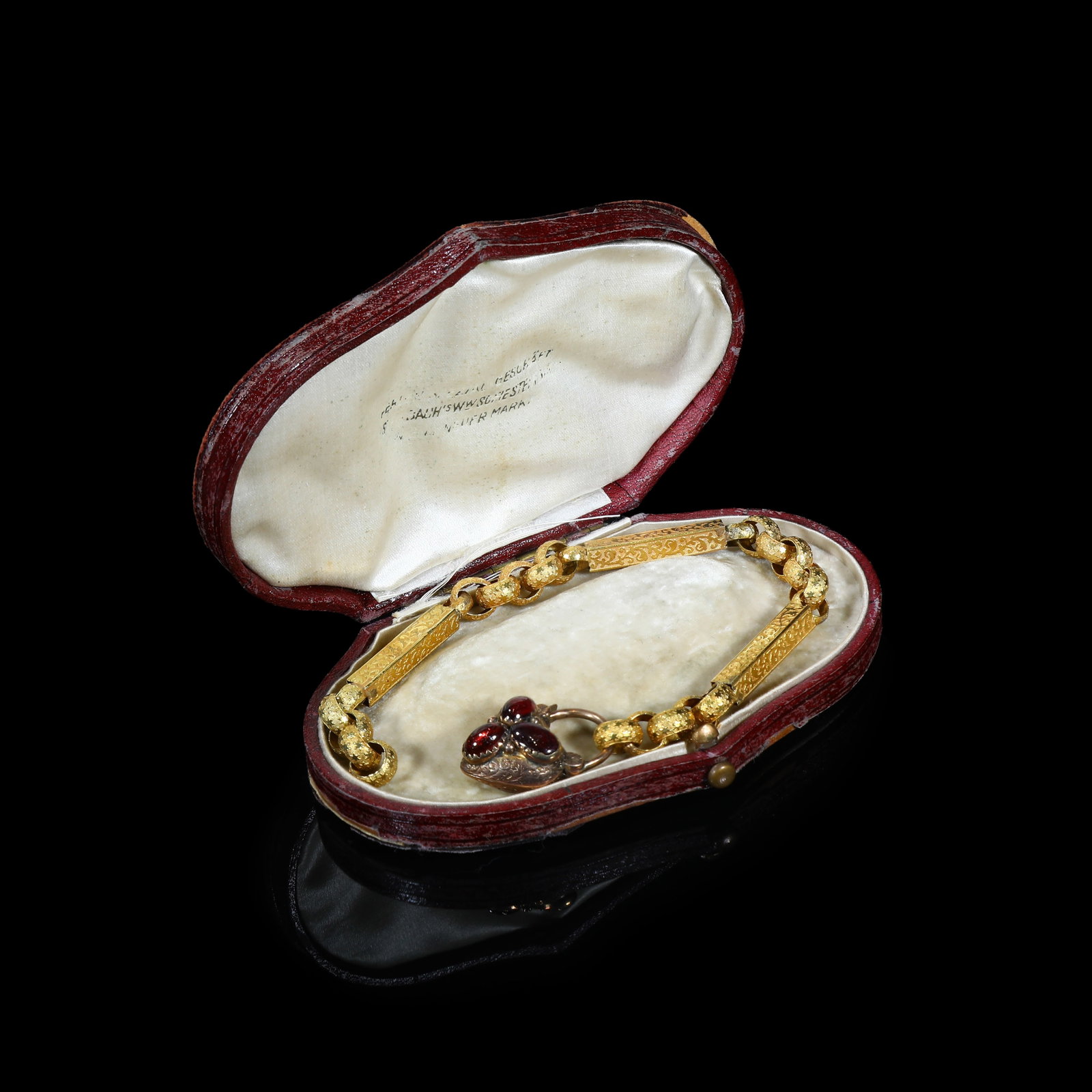 Victorian Gold-Silver-Copper Alloy Engraved Bracelet With Heart-Shaped Garnet-Set Locket-Clasp,: Bracelet Length:21.5cm Wt:12.11g Victorian bracelet, circa 1860-1890. Constructed of foliate-engraved rectangular links alternating with rope-twist chain links. The fastening is an opening heart-shape