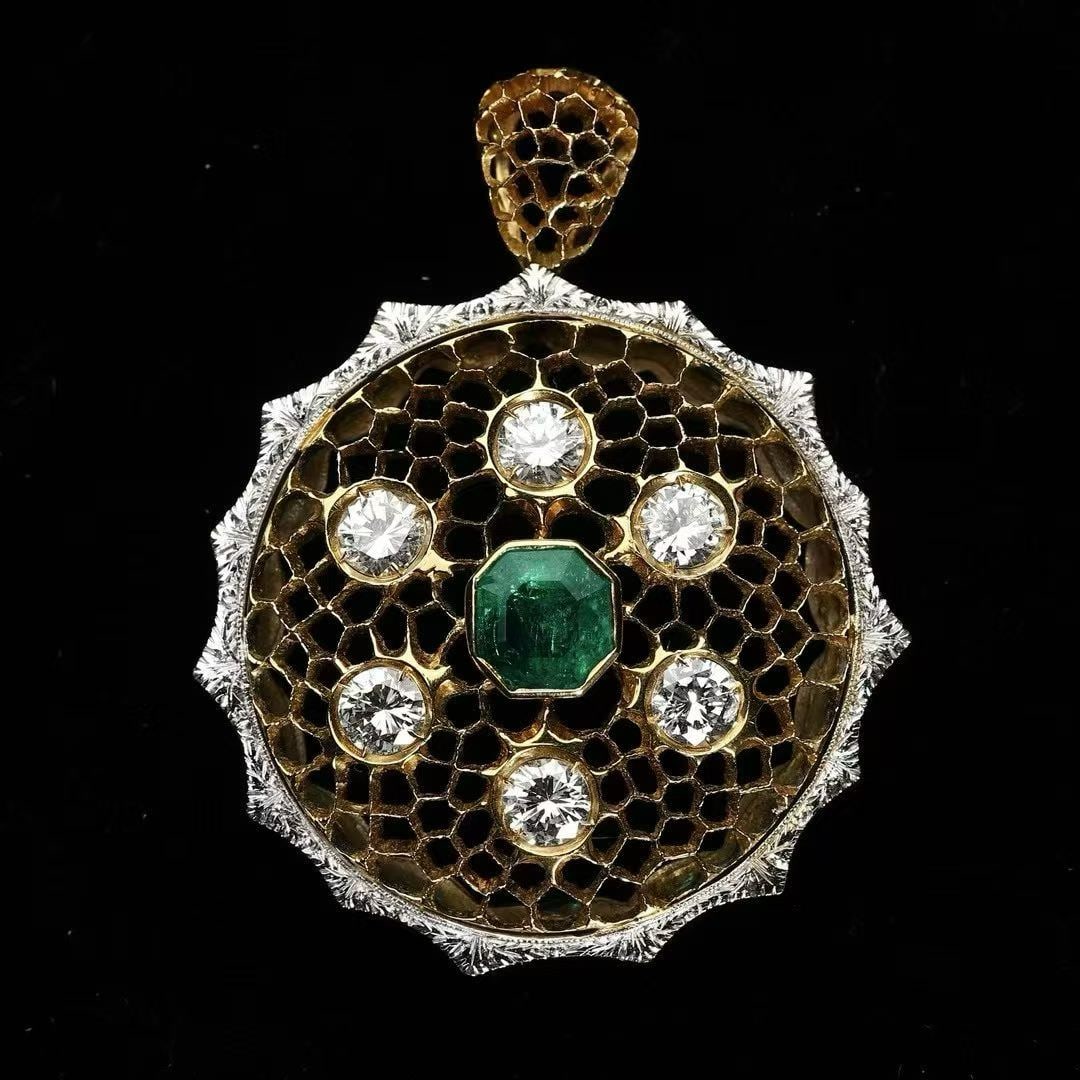 Art Deco Period (1925-1935) 18K Two-Tone Gold Diamond and Emerald Pendant in Wirework Granulation: L:4.3cm W:3.4cm Wt:12.4g The "Tullework" technique, also known as honeycomb carved goldwork, is a fully hand-piercing craft inspired by Renaissance lace fabrics. Artisans first punch round holes in a 
