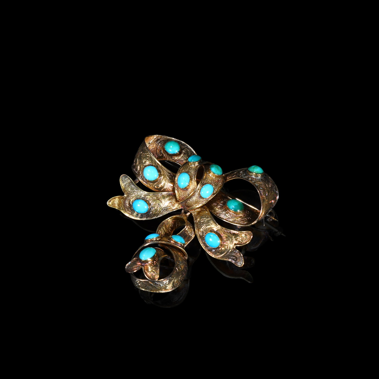 Victorian Period 20-Carat Gold Turquoise Bow Brooch, with turquoise certificate: 4.54*4.cm Wt:8.43g Antique brooch of the Victorian period, modelled as a double-bow and crafted in 20-carat gold. The metalwork is finely chased with scrolling foliate motifs. A smaller, freely-swingi