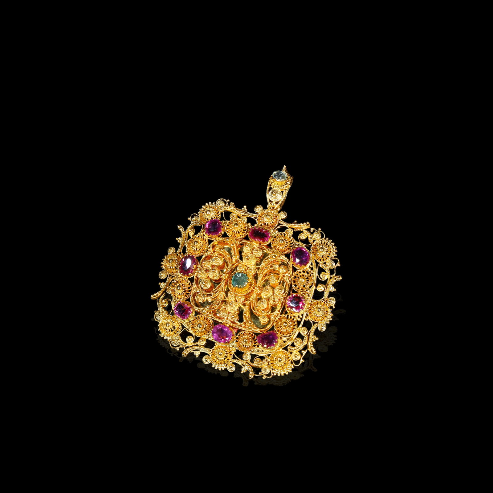 19th-Century Iberian Gold Filigree Brooch-Pendant, Ruby & Emerald, Circa 1820-1860: 3.62*3.75cm Wt:14g 19th-century Iberian filigree brooch-pendant, circa 1820-1860. Crafted in gold with elaborate open-work filigree scrolling floral motifs, set with multiple rubies and emeralds. Dual