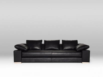 Canyon Sofa - Black Leather / Ash Feet: The Canyon Sofa was designed in 1994 by founder Brian McGuigan and remains surprisingly contemporary. The generous proportions allow this sofa to double as a daybed. Retail value: $12,800. The