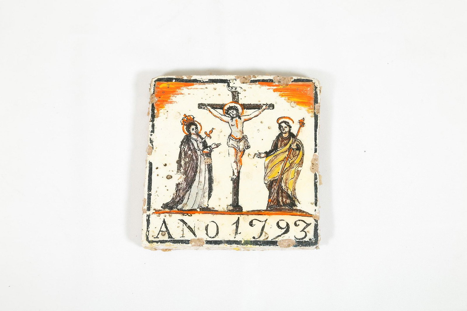 Crucifixion: 14 x 14 cm Polychrome ceramic on tile. Dated 1793. Small lacks and color losses.