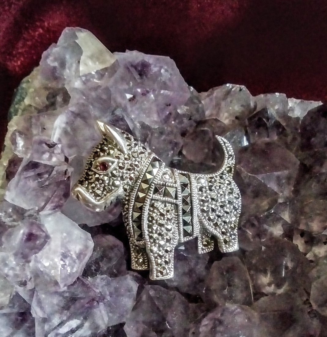 Sterling silver marcasite Scotty Dog brooch pin: Sterling silver marcasite Scotty Dog brooch pin. Heavy solid piece with amazing detail. Garnet eyes. Perfect condition