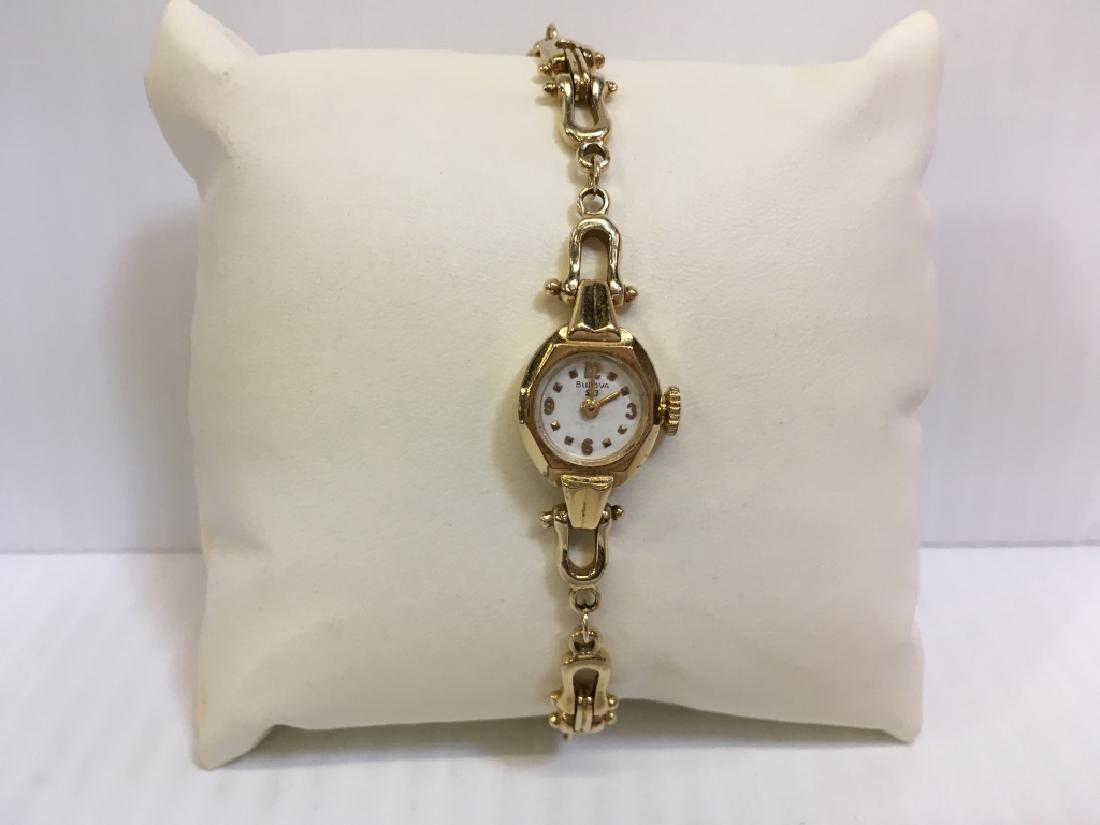 18K BULOVA LADIES' WATCH W/ 14K BAND: Bulova ladies' 18K yellow gold watch S69304 (not working) with a 14K yellow gold chain band - 21g total.