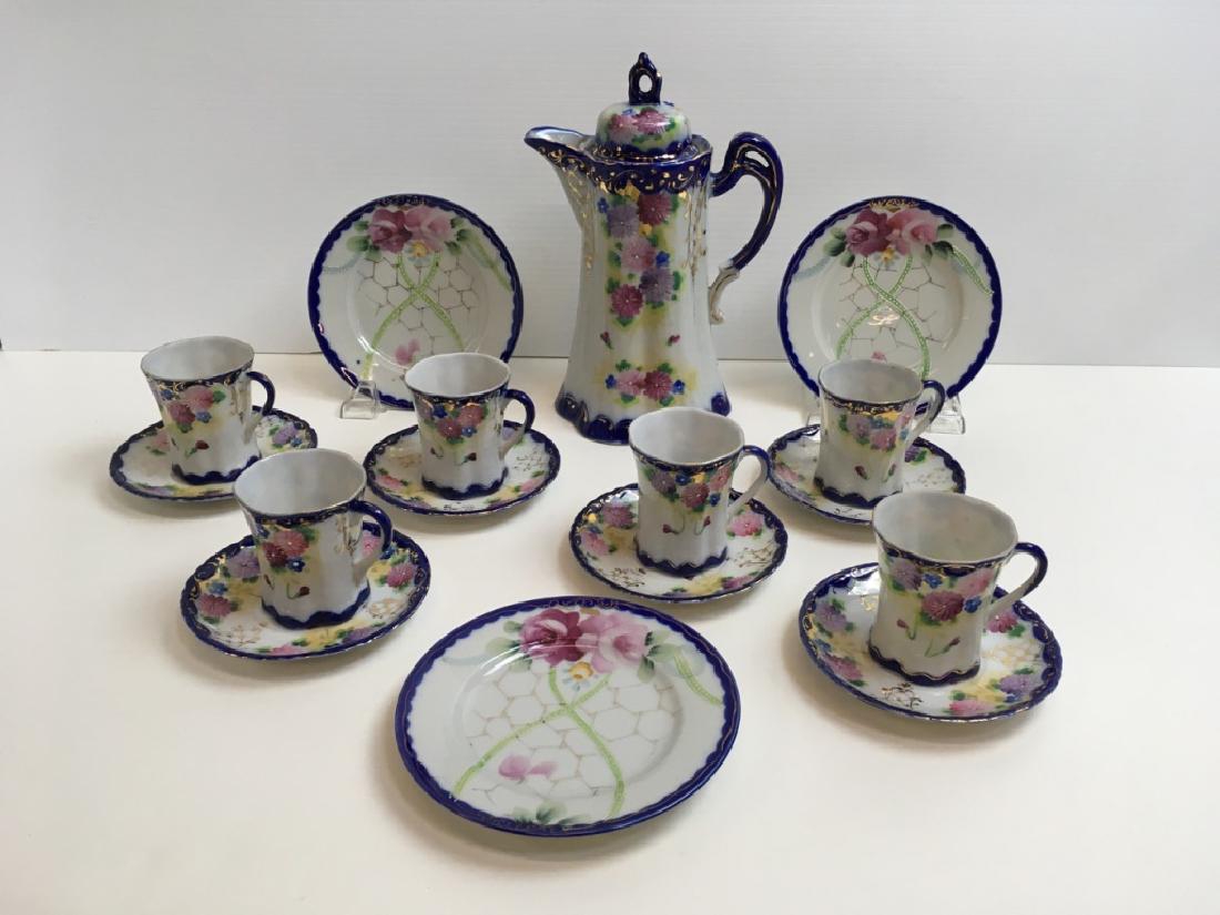 10 PCS VINTAGE HAND PAINTED PORCELAIN: Hand painted cobalt on white Chocolate pot w/ 6 cups & saucers - made in Japan plus 3 complimentary 6" Nippon plates.