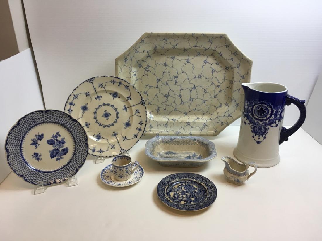 8 PCS OF ANTIQUE EARTHENWARE: 17.5" platter "Marble" W.P. (crazed), 9" cobalt on white ironstone pitcher (chip on base), 10" plate "Stockholm" England (chip), 8" Cauldon England "Ruskin" plate (crazed), 8.5" l blue transfer ware b