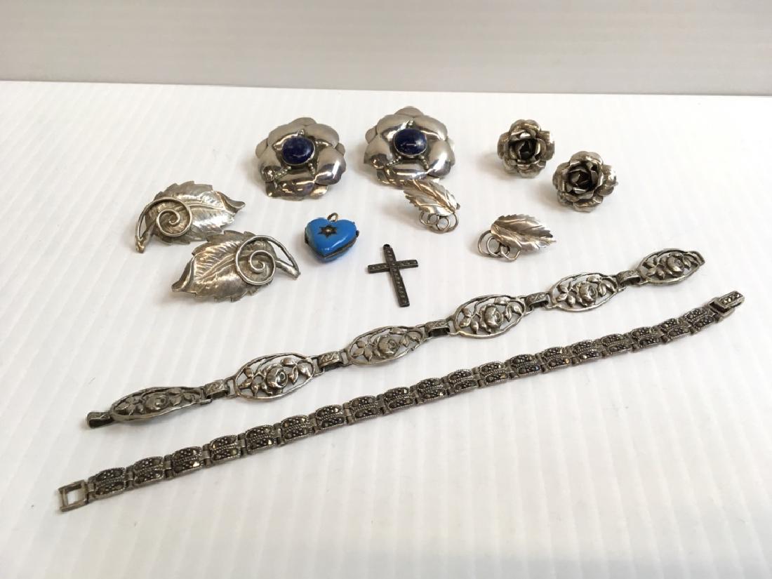 12 PCS OF STERLING, MARKED 925 & 800 JEWELRY: 800 rose design link bracelet, 3 prs of sterling screw back earrings - 24g (rose & leaf designs), unmarked vintage enamel heart locket, sterling marcasite cross "THEDA", 925 marcasite 7.5" bracelet & 